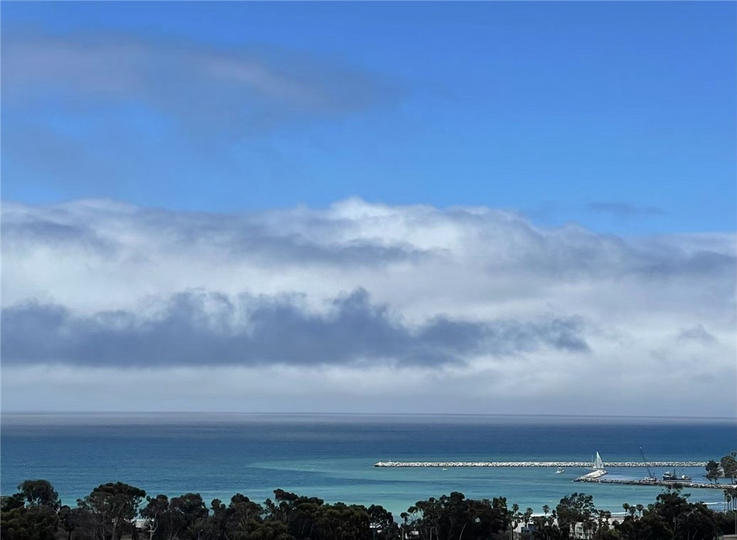 Enjoy panoramic views of the Ocean *Dana Point Harbor *City lights *Mountain views from every level !! Built in ELEVATOR!! This stunning contemporary tri-level home is located at the gated community of San Juan Harbor View, built by Toll Brothers. This first-row residence features 4 bedrooms plus office, 5 bathrooms. The entry level includes a large bonus room, a bedroom suite, and a beautifully landscaped backyard. The second floor features an open floor plan with a gourmet kitchen, dining room, large great room, and a flexible bonus space currently set up as an office. The expansive balcony on this level is perfect for enjoying the 180-degree ocean view and stunning sunsets. The third floor has the master suite and two additional bedrooms , a full bathroom, and a laundry room . Conveniently located with easy access to the 5 freeway, nearby beaches, renowned resorts, shopping centers, schools, Dana Point Harbor, community parks. Pacifica San Juan offers a resort-style recreation center, pool, spa, covered cabanas, BBQ area, and fitness center.