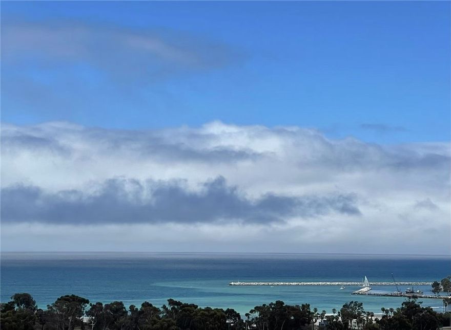 Enjoy panoramic views of the Ocean *Dana Point Harbor *City lights *Mountain views from every level !! Built in ELEVATOR!!  This stunning contemporary tri-level home is located at the gated community of San Juan Harbor View, built by Toll Brothers. This first-row residence features 4 bedrooms plus office, 5 bathrooms.  The entry level includes a large bonus room, a bedroom suite, and a beautifully landscaped backyard. The second floor features an open floor plan with a gourmet kitchen, dining room, large great room, and a flexible bonus space currently set up as an office. The expansive balcony on this level is perfect for enjoying the 180-degree ocean view and stunning sunsets. The third floor has the master suite and two additional bedrooms ,  a full bathroom, and a laundry room . Conveniently located with easy access to the 5 freeway, nearby beaches, renowned resorts, shopping centers, schools, Dana Point Harbor, community parks. Pacifica San Juan  offers a resort-style recreation center, pool, spa, covered cabanas, BBQ area, and fitness center.