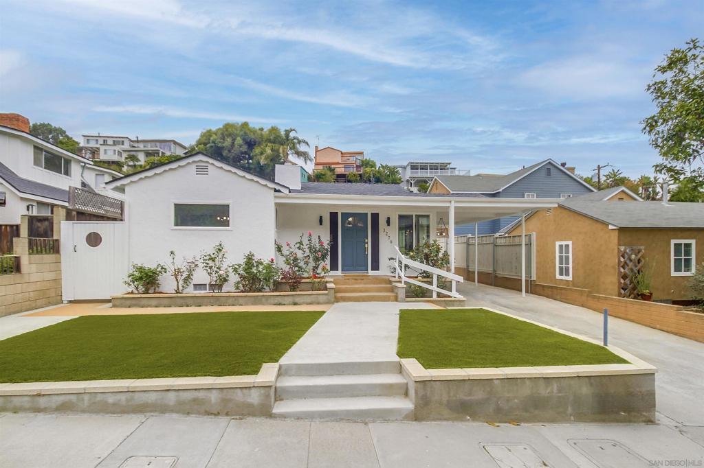 Discover unparalleled charm in this breathtaking 4-bedroom, 2-bathroom masterpiece, complete with a 1-bed, 1-bath Jr ADU, nestled just steps from the iconic La Playa Trail and the serene San Diego Bay. This newly remodeled and redesigned coastal gem has sophisticated modern upgrades, offering a move-in-ready haven that’s as functional as it is stunning. Step into a gourmet chef’s kitchen that’s sure to inspire culinary creativity, boasting a premium Kostch 5-burner range with broiler, sleek Hisense fridge, and whisper-quiet LG dishwasher. The kitchen dazzles with white oak cabinetry, luminous quartz countertops, a stylish tile backsplash, a cozy breakfast nook, and an expansive pantry for all your storage needs. Retreat to the opulent master suite, where a marble fireplace sets a warm, inviting tone. Unwind in the spa-like bathroom featuring dual shower heads, a double vanity, and elegant white oak cabinetry, complemented by a spacious walk-in closet and sleek tile flooring. Every amenity in this home exudes quality, from a new roof in the main home, electric AC and energy-efficient vinyl dual-pane windows to modernized plumbing and electrical, chic designer light fixtures, and graceful decorative arches that add architectural flair. The open-concept layout flows effortlessly, with generous closets in all bedrooms and a dedicated laundry room for ultimate convenience. The attached Jr ADU is a modern gem of its own, featuring a contemporary kitchenette with white oak cabinets, quartz counters, a 4-burner stove, a fridge, and a mini-split AC/heating system for year-round comfort, plus a full bathroom perfect for guests, family, or rental potential. Outside, a 2-car garage with an attached workshop and ample parking, including a covered space for your RV or boat, ensures all your lifestyle needs are met. This Point Loma treasure is more than a home. It’s a coastal lifestyle, blending beauty and comfort in an unbeatable location.