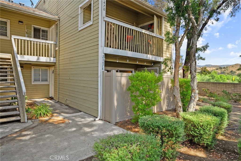 Tired of the commute!?! You could be HOME by now! Located in the highly desirable -Villages- community of Yorba Linda just minutes off the 91 and Gypsum Canyon, this beautifully maintained downstairs unit offers 2 bedroom, 2 bathrooms a large living area with fireplace and updated kitchen! From the moment you step inside, you'll be welcomed by an inviting living room featuring a cozy fireplace and expansive windows that flood the space with natural light while offering a lovely view of the private patio. The thoughtfully designed kitchen is a true highlight, showcasing gorgeous granite countertops, a stylish tile backsplash, sleek stainless steel appliances, and abundant cabinet and counter space for all your culinary needs. Just off the kitchen, the dining area provides a warm and intimate setting—ideal for both casual family dinners and entertaining guests. The executive suite is a peaceful retreat, complete with large windows that bring in soft morning light, generous closet space, and an en-suite bathroom featuring an extended vanity and a spacious walk-in shower. The secondary bedroom and bathroom are equally well-appointed, offering comfort and privacy for family members or overnight visitors. Step outside to discover a private large covered patio—perfect for outdoor dining or relaxing in the shade—and a convenient storage shed that also houses your own private laundry area! Appreciate a detached 2 car garage as well! As part of The Villages, residents enjoy access to a variety of community amenities, including a refreshing pool and spa, playground and picnic area, sport court, and meticulously landscaped grounds. The location offers easy access to shopping and dining at nearby Savi Ranch and the Bryant Ranch Center, and convenient commuting via the 91 Freeway. This charming condo is a rare opportunity to enjoy resort-style living in one of Yorba Linda’s most sought-after communities.