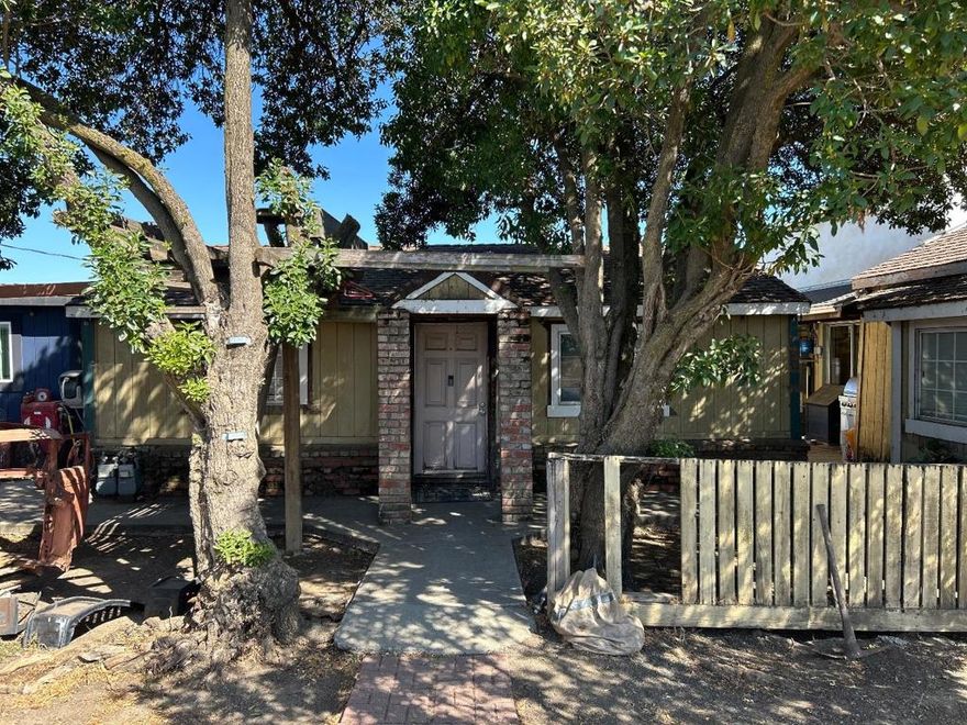 Opportunity knocks in Gilroy! This multi-structure property is perfect for investors, contractors, or buyers looking for a fixer with incredible potential. The original, single-story home includes a compact kitchen, living area, a full bathroom, and an unfinished basement - all in need of renovation. A separate, detached, unpermitted living unit features a quaint kitchen, cozy living room, breakfast nook, one downstairs bedroom, and two attic-style rooms upstairs. This unit was built without a permanent foundation and currently rests on wood supports - bring your vision and contractor to explore retrofit options. In addition, you will also find a detached laundry room and a detached 3-car garage (garage space is unpermitted). This property is located in an area with convenient access to shopping, dining, and Highway 101. With vision and renovation, this could be a great investment or multi-use property. Property is being sold as-is and requires significant work. Buyer to verify all square footage, permits, and potential uses.