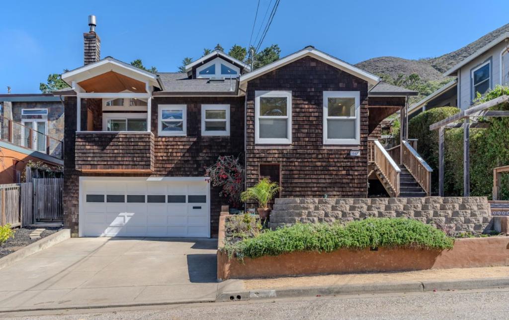 Welcome to 647 Canyon Drive, located in the beautiful East Sharp Park neighborhood of Pacifica. This gorgeous home boasts 4 bedrooms, 2 of which are en suite, and 3 full bathrooms. As you enter this home, you will be wowed by the vaulted ceilings and numerous windows allowing for an abundance of natural light to fill every room. There is a spacious kitchen, perfect for your inner chef to get to work, with an adjacent family room with a wood burning fireplace. Along with the main living space, the first level also includes 2 guest bedrooms, 1 full bathroom and a flex space with laundry hookups (washer/dryer currently in place), which could also be used as an office, study area, mudroom, etc. Upstairs you will find the primary bedroom and spa like bathroom, an additional bedroom with attached bathroom and a charming loft area with shelving. Outside you will find many areas to relax, garden, grill and play! The deck right off of the dining room is a great space to enjoy meals outside. The back part of the yard is a wonderful place for a fire pit. The lower part has a patio and the potential for a home grown garden. Also in the backyard is a spacious shed with electrical. Maybe a home office, yoga studio or art room? A 2 car garage rounds out this amazing home. Definitely a must see!
