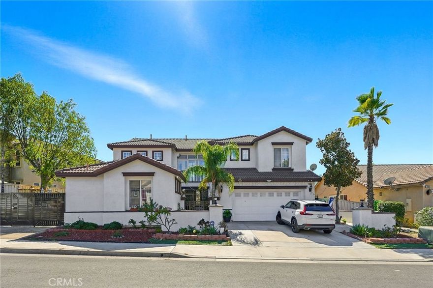 Beautiful two-story former model home featuring 2,880 sq. ft. of well-designed living space with 5 bedrooms and 4 full baths. The inviting floor plan includes a spacious family room with fireplace, formal entry, bright living room, and an open kitchen with tile counters—perfect for entertaining. The home offers both comfort and functionality, with two bedrooms and two full baths conveniently located on the main floor, including a main-floor primary suite. Upstairs, the large master suite features a luxurious bath with double sinks, separate tub and shower, walk-in shower, and walk-in closet. Bathrooms include low-flow toilets, double vanities, and modern fixtures throughout. Additional highlights include a laundry room, ample storage, and multi-level bedroom layout ideal for families or guests. Don’t miss this move-in ready home that combines space, comfort, and style in one!