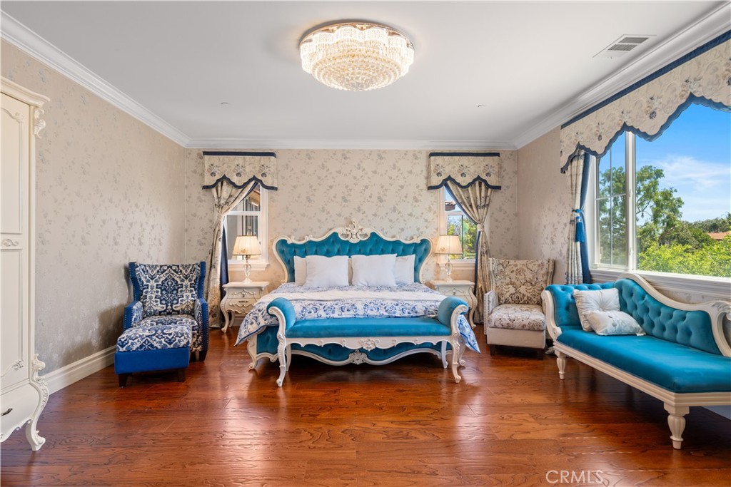 A rare opportunity to own a high-end, custom-designed estate home offering 5,142 square feet of refined luxury and grandeur. Every detail of this exquisite residence reflects the owner’s dedication and passion for quality living, with imported, custom-selected materials throughout. Even the solar power and water softening systems have been fully paid off, providing a high-quality, low-maintenance lifestyle.
This thoughtfully crafted home features 4 spacious bedrooms, plus a separate guest suite with a private entrance—ideal for family members, long-term guests, or added privacy.
Upon entry, you’re welcomed by soaring ceilings and a grand imported crystal chandelier, creating an impressive and majestic ambiance. The formal dining and living areas are also adorned with imported crystal lighting, blending elegance with sophistication. The gourmet kitchen boasts an oversized island, a walk-in pantry, and expansive prep space—perfect for both daily meals and entertaining. A fully equipped secondary kitchen adds convenience while keeping the main living areas smoke- and odor-free.
The luxurious primary suite offers a peaceful private retreat, complete with a generous sitting area. Upstairs, a bright and expansive loft provides versatile space ideal for family gatherings, play, or relaxation.
The outdoor areas are equally stunning, featuring a spacious private courtyard and a beautifully designed fountain, creating a tranquil and inviting environment. The three-car garage offers abundant parking and exceptional storage capacity.
Located in a highly sought-after upscale community, this home seamlessly blends comfort, elegance, and functionality—an ideal choice for those seeking a truly elevated lifestyle?