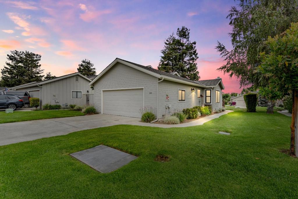 Rare, single-story unit at The Bluff's! Check out this end unit with SO many upgrades before it's too late! Recent updating includes: Milgard windows & sliders ("Oreo" style black exterior/white interior. So cool! ), barn door style primary shower door with rain glass, rain glass at second bath shower enclosure, owned solar system, marble entry & marble fireplace surround & hearth, extensive LVP flooring throughout, kitchen upgrades include granite slab counter with Kohler undermount sink & semi-pro faucet, 5 burner gas cooktop, newer oven, microwave dishwasher, & disposal, granite slab counter at laundry room, Corian counters in bathrooms with chrome fixtures, water softener & purifier system, cabinet pulls, light fixtures, furnace & AC units. But wait, there's more! Unique pebble stone flatwork at rear patio, Snap Power Guide Lights at wall plugs, awesome custom epoxy garage floor, new insulation at attic that is "over-code", garage door & opener, water heater, blinds, door hardware, & much more! Courtyard has low maintenance artificial turf, apricot, apple, & lemon trees too! What are you waiting for? Opportunities like this don't come along every day. Call your Realtor today & come see why this just might be your next home at the Country Club?!