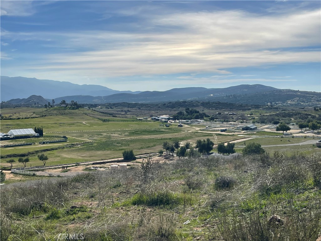 WELL ON PROPERTY. POWER ON PROPERTY. PARTIALLY GRADED UPPER PAD. 360 * VIEWS. This exceptional parcel of land spans almost 62 acres, boasting gentle slopes and a conveniently flat pad, the ideal canvas for crafting your custom home with breathtaking 360-degree views that will leave you in awe. If this is more land than you can dream of using, it can be subdivided into 5 acre parcels as well! There is an actual tentative tract map already available.
Nestled in the heart of nature's embrace, this property is strategically located just minutes away from the enchanting Temecula Valley wine country, offering you the perfect balance between tranquility and accessibility. Indulge in the best of both worlds as you relish the serenity of this expansive property, while still being close enough to the vibrant social scene.
Endless possibilities await you here, making it the perfect canvas for creating your very own private compound. Whether you envision a luxurious retreat, a sprawling estate, or a charming farmhouse, this land provides the space and versatility to turn your vision into a reality.
Embrace your agricultural aspirations and revel in the boundless potential for income generation. Zoned rural residential, this property opens the door to various lucrative ventures. Take advantage of the abundant space to raise livestock, cultivate thriving agriculture, or even embark on the journey of developing your very own vineyard, tapping into the renowned wine country atmosphere nearby.
Water is never an issue, as a well is already established on the property, ensuring a reliable and sustainable water source. Additionally, power is conveniently connected, streamlining the building process and offering the convenience of modern living even amidst the tranquility of this pristine location.
Escape the hustle and bustle of city life and immerse yourself in the serenity of nature, enveloped by the picturesque beauty of the landscape surrounding your future home. Savor the harmonious blend of rural charm and contemporary living, where you can create cherished memories with family and friends in the comfort of your private haven.
Don't miss this once-in-a-lifetime opportunity to claim your very own slice of paradise, combining space, seclusion, and income potential in one remarkable package. Envision the possibilities, seize the moment, and make this dream property your own!