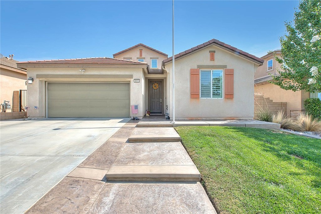 Highly Sought After Multi-Generational Floor Plan Home in The Rosena Ranch Community! This Lovely Home was Built in 2017 and Features Two Primary Bedrooms and Two Additional Bedrooms Plus an Office, 3.5 Bathrooms and 2649 Square Feet of Living Space. The Main Level has a Large Great Room with a Family Room with a Gas Fireplace, Built in Shelving and a Dining Area. The Kitchen has a Huge Center Island with Granite Countertops and Stainless Steel Appliances Include a Gas Range, Dishwasher, Microwave and Fridge. The First Floor Also has a Primary Suite with a Walk In Closet, Retreat Area and a Full Bathroom with a Shower and Dual Sinks. There is also an Office with Double Door Entry and a Guest Bathroom too. The Second Floor Also Has a Primary Suite with a Walk In Closet and Bathroom with Double Sinks, A Large Tub and a Separate Stall Shower. There Are Also Two Additional Bedrooms and another Full Bathroom on the 2nd Level. Indoor Laundry Room with Built in Cabinets Upstairs and Includes the Washer/Dryer. Three Car Tandem Garage with Opener and Two Built in Overhead Storage Racks. The Interior of the Home has Several Upgrades Including Tile Flooring, Shutters Throughout, Built in TV's in Family Room & All Bedrooms, Crown Molding in Great Room and Office, Water Softener System, Multi Zoned A/C unit with 3 Separate Thermostats and a Generator. Fully Landscaped Front and Rear Yard with Custom Hardscape, A Covered Patio with Built in Lighting and Vinyl Fencing. Leased Solar System. Located in the Rosena Ranch Community with Access to Community Areas Including the Pool, Spa, Parks, Trails and Common Areas. Located Near the K-8 School. This Home Shows Beautifully and Has Convenient Access to Community Facilities, Schools and Freeways!