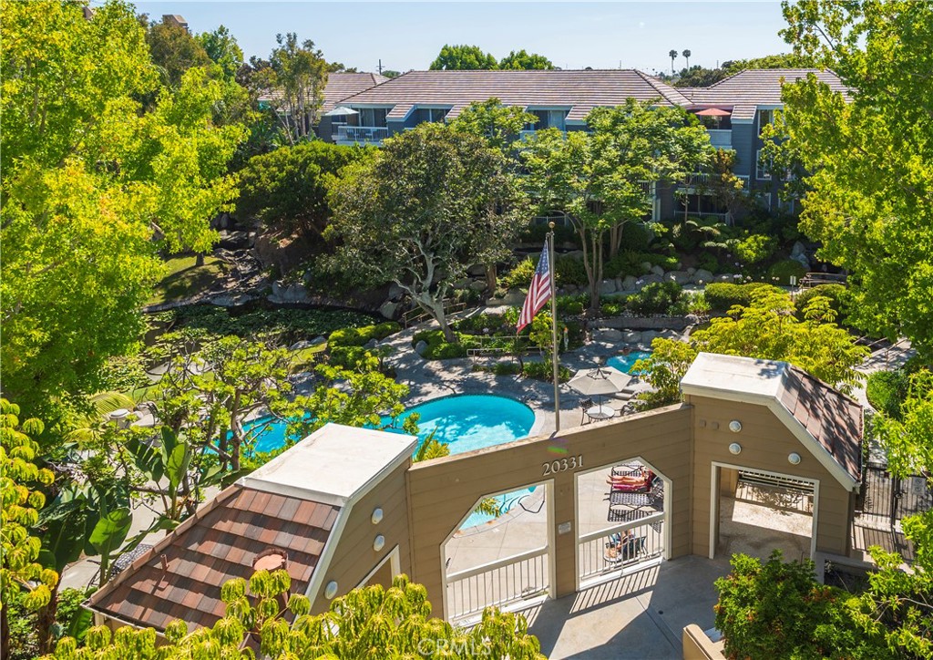 PRIME PENTHOUSE CONDO WITH GORGEOUS NUMBER 1 VIEWS OF THE MAIN COURTYARD WITH LARGE LAGOON, WATERFALLS, POOL, JACUZZI, AND FRESH OCEAN BREEZES ! Absolutely Beautiful ! End Unit with 3 sides of light - Ice cold Air conditioning ! Upgraded Granite counters with Breakfast Bar - Large niche is perfect for a home office - Custom separation creates an awesome bedroom area - Soaring cathedral ceilings plus Loft area ! Loft can be made into a Bedroom, Office, Storage and more - Upgraded Shutters thru-out -Lots of closet space can easily be turned into large walk-in closet ! Inside Washer/Dryer - Seabridge is a Gated community with Pools, Jacuzzi's, Tennis Courts, Great Gym and large Sauna - Just Down the street from the Beach, Huntington Beach Pier, Main Street, Amazing shopping and Restaurants !!! Life is Beautiful !