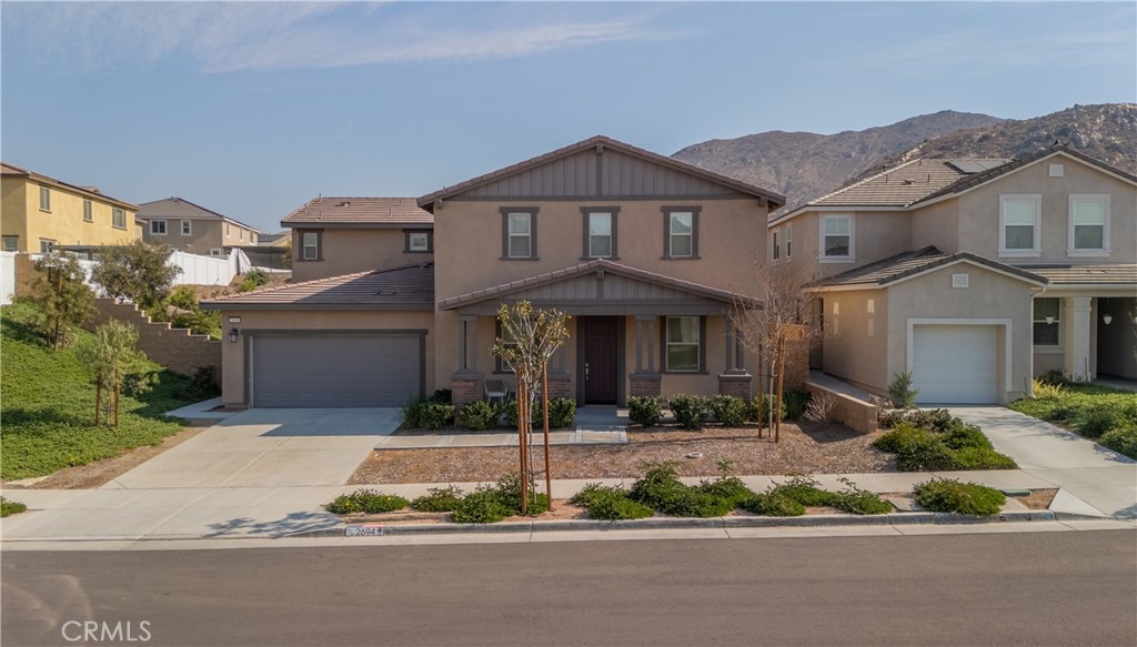 Set on a prime corner lot, this expansive Jurupa Valley home offers the perfect blend of space, comfort, and upgraded living. This two story home offers 6 bedrooms and 3 full bathrooms, perfect for large or multi-generational families. With 3,325 square feet of living space, the open concept kitchen and living room provide a modern and comfortable lifestyle. The home includes two downstairs bedrooms, ideal for guests or extended family. The backyard has been beautifully updated with a new fire pit and retaining wall, perfect for entertaining. Located on a corner lot in a quiet neighborhood, this property also features a three-car garage, a Tesla wall charger, and paid-off solar panels. Additional highlights include a loft, a landscaped yard, no HOA, and a prime location in the heart of Jurupa Valley, CA. Don't miss out on this opportunity!