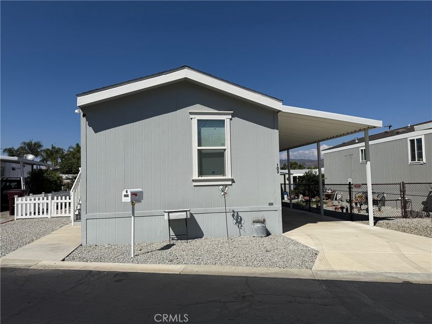 Welcome to Fairview Park Estates, a 55+ community in East Hemet! This beautiful 2020-built home offers 2 bedrooms and 2 bathrooms across 868 sq. ft. of comfortable living space. The open floor plan features a spacious living area that flows seamlessly into the kitchen and dining area, perfect for entertaining or everyday living. The kitchen boasts modern cabinetry, ample counter space, and granite-style finishes. Each bedroom is located on opposite ends of the home for added privacy, with the primary suite offering a large closet and private bath. Enjoy peaceful mountain views from your covered carport or from the rock scaped yard, complete with a small fenced area and storage shed. The home also features an accessibility ramp and a quiet location within the park. Fairview Park Estates is a 55+ community offering a clubhouse with pool and spa, library, laundry and recreation area. Low space rent of approximately $630 per month includes access to all park amenities. Move-in ready and meticulously cared for — this home combines modern comfort with affordable senior living in the heart of Hemet. MORE PHOTOS COMING SOON!