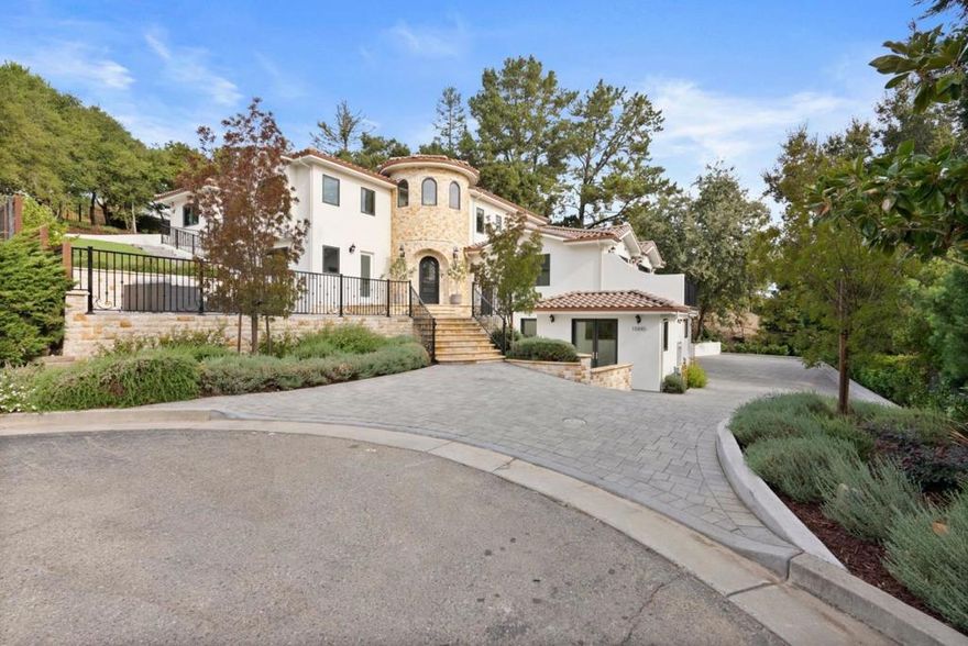 Experience the elegance of this brand-new, Mediterranean inspired custom-built home, meticulously crafted with upscale design and distinctive architectural details. This classic home nestled on a quiet, private courtyard features a grand round tower entryway made with travertine stone and terra cotta roof. Upon entering, the circular staircase invites you to the vast open layout, with 6 spacious bedrooms, 5 full baths, and 2 half baths. The stunning kitchen features a Wolf dual-fuel range with infrared griddle, and an oversized island ideal for daily living and entertaining. The family room, media/entertainment room, and game room, provide endless options for relaxation and gathering. The primary suite is a true retreat, offering a spa-inspired ensuite, a jetted tub, heated floors, and a spacious double shower setup complete with a steam shower for ultimate relaxation.  A potential in-law suite with plumbing hookups for a kitchen and a separate entry offers added privacy for guests or extended family members. This home also includes a 3-car garage with an elevator for easy access throughout. Located within the highly acclaimed Cupertino School District, this property offers access to some of the area's top rated schools, combining educational excellence with a prime location.