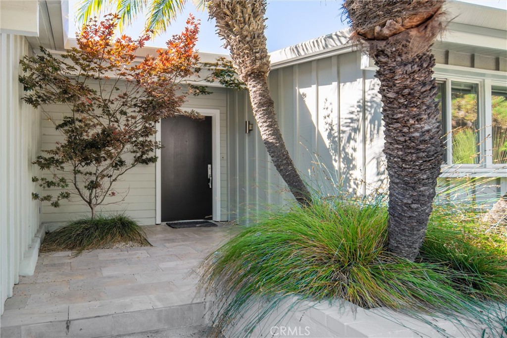 Stunning quintessential Mid Century modern rumored to be designed by Edward H. Fickett, AIA, Circa 1956. Situated on one of the most desired and quiet streets in Sherman Oaks Hills, this beautiful property offers a custom tile entry, breathtaking rare unobstructed views, and a custom-built heated pool with Italian tile, and custom detailed design throughout. The interior features wide plank engineered flooring, quartz countertops, and Stainless appliances, and a designer kitchen that adds elegance to the design. Outside, there's a spacious deck with a fashionable railing, a gas and a propane fire pit, and multiple outdoor spaces including a dog run. Enjoy exterior tile flooring, custom benches, and glass elements to accentuate the views. The pitched roof adds to the classic mid-century appeal with classic glass features. The property is equipped with a Nest Thermostat, EV Charging Station and a "Back to Base" Security System. Zoned for Roscomare School District. Don't miss the opportunity to live in this perfect blend of modern luxury and timeless design!
