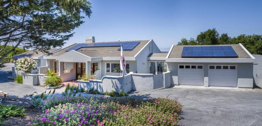 Experience a rare opportunity in the gated community of Halcyon Heights, where privacy, ocean views, and the natural beauty of the Monterey Coast come together. Designed by acclaimed architect John Thodos, this transitional contemporary 4-bedroom, 3-bath home is situated on an expansive 1.11-acre lot at the end of a quiet cul-de-sac, offering a peaceful setting with panoramic views within the area's prized sun belt. Oversized windows at this elevated vantage point fill the home with light and showcase sunset views from every terrace. A reverse floor plan is thoughtfully designed to maximize views, with multiple outdoor spaces creating a seamless indoor-outdoor flow perfect for entertaining or quiet relaxation. The main level offers single-level living with a spacious primary suite and private terrace, plus open living, dining, kitchen, formal entry, laundry, and garage access. The lower level features 3 additional bedrooms, ideal for guests, an office, or a fitness space. A spacious yard is ideal for pets, gardening, play, and nature. Ideally located near Carmel, Monterey, & world-class golf, this architecturally detailed contemporary home offers a rare opportunity to enjoy the tranquility & natural beauty of one of the coast's most desirable neighborhoods.