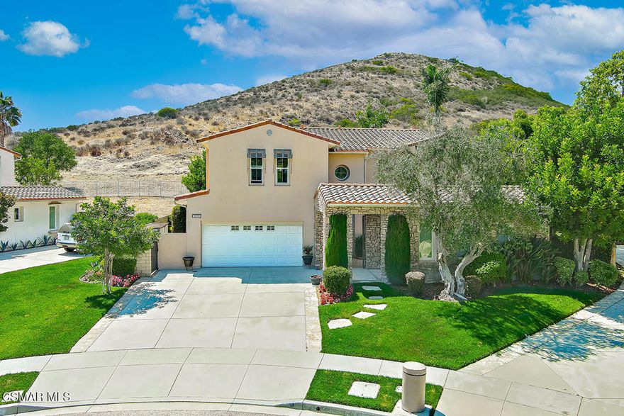 Welcome to the beautiful MonteRey collection in the prestigious Dos Vientos community. This gorgeous home is an entertainer's delight; offering versatility of a spacious floorpan and an amazing yard with pool, jacuzzi, waterslide, built in BBQ, Firepit with wonderful built in seating. Situated on a premium lot, backing to open space and boasting beautiful hillside views and quiet location. This floorpan offers 4015 square feet. The cathedral ceiling entry way welcomes guests to a warm environment offering classic hardwood floors throughout the downstairs. This home has been beautifully maintained and boasts a yard to meet all your family or entertainment needs. This wonderful home with spacious living room & formal dining room, is a sought after floorpan. The spacious gourmet kitchen with large center island, 6 burner gourmet gas stove, granite counters with eat in bar area, stainless steel appliances, desk area and large eating area. Adjacent to kitchen is a large great room with fireplace for wonderful ambiance when entertaining. Off the entry way, this floorpan has one bedroom /shown as office (without closet) and bathroom with step in shower downstairs. There is a large closet in downstairs hallway off bedroom extending back under stairs. Heading upstairs, notice the amazing  primary suite with office/library, fireplace for relaxing and privacy of the luxurious large bedroom with lots of natural light and retreat area for office space or lounge area. The suite also includes a large walk-in closet. The impressive primary bath offers a spa-like bath also offers jetted tub and separate vanities. Upstairs laundry located off owners suite and nearby 3 additional upstairs bedrooms. One upstairs bedroom offers en-suite private bath. The other two bedrooms attached to bathroom with dual sinks and shower with tub. Heading downstairs and outside, beautiful French door opens to the tranquil hillside backyard.  Perfect for relaxing outdoors on your own, with family or throwing a large gathering.  This home is situated amongst parks, hiking, biking trails, as well as ''the village'' shops and top rated schools. This home is ready for you to move in. Note: Downstairs Bedroom in photos-does not feature a closet, shown as office. 3rd car garage is virtually staged as gym.