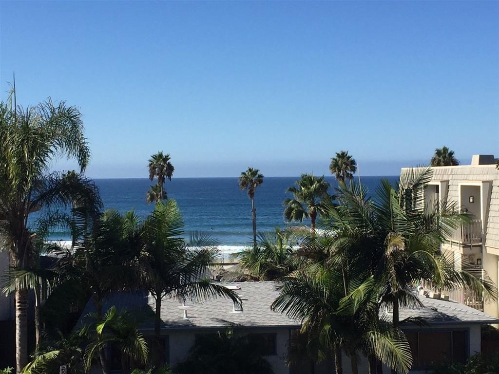 Unbelievable white water views from this remodeled 2nd Story condo! This large 2 bedroom single story unit is a few steps from the beach with ocean views from the master bedroom, kitchen, living room and balcony! New quartz counters throughout, crown molding, tile, kitchen has s/s appliances a farmhouse sink, and more! 2 full bath, laundry in unit, and complex has tons of amenities including a pool/jacuzzi, tennis court, gated underground parking, outdoor showers! Walk to restaurants, shops, and more! Neighborhoods: Oceanside Equipment: Garage Door Opener Other Fees: 0 Sewer: Sewer Connected Topography: LL
