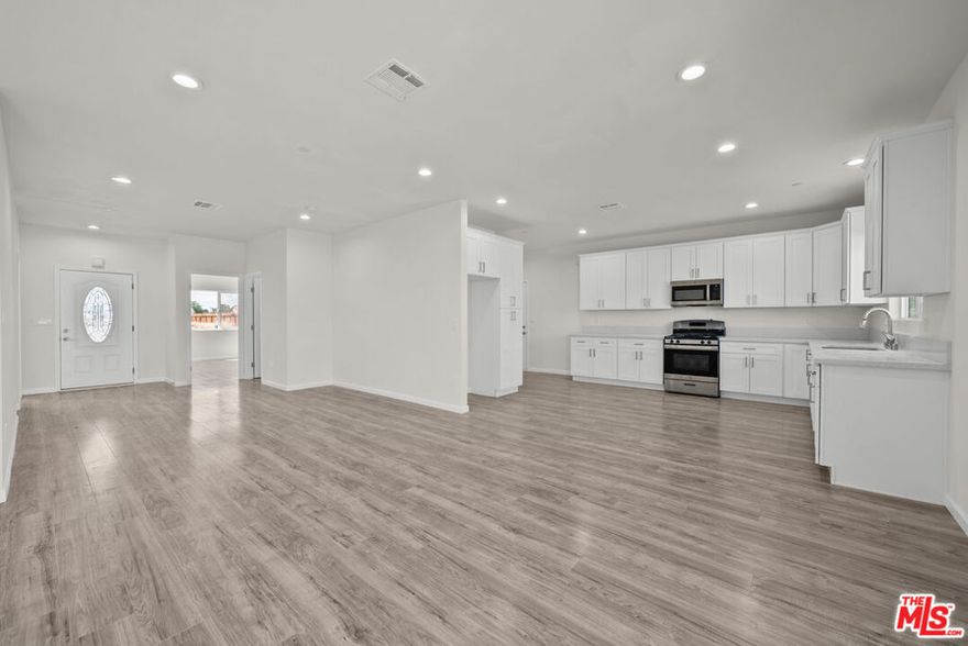Welcome to your dream home, built in 2023! This beautifully crafted residence offers 4 spacious bedrooms and 2.5 modern bathrooms, spread across 2,134 sq ft of open-concept living space. Step inside to find stylish laminate flooring throughout, creating a seamless and contemporary look. The heart of the home is the gourmet kitchen, featuring quartz countertops, ample cabinet space, and sleek stainless-steel appliances including a stove, dishwasher, and microwave. The laundry area is conveniently tucked away in a dedicated closet, and all bathrooms are finished with elegant tile flooring. Each bedroom offers generous closet space, perfect for comfortable living. Outside, enjoy a large backyard with endless possibilities for entertaining family and friends. Plus, the fully paid-off solar panels add long-term value and energy savings. This move-in-ready, turnkey home is a must see, don't miss your opportunity!