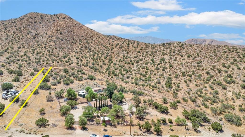Embrace the freedom and serenity of nature with this 5.23-acre parcel in the heart of Acton, CA. Surrounded by rolling hills and breathtaking mountain views, this expansive lot offers endless possibilities—whether you're dreaming of building a custom home, creating a private retreat, or investing in a piece of California’s natural beauty. This property provides the perfect blend of seclusion and accessibility. Experience the peace of country living while remaining within reach of local amenities and major highways. Don't miss this rare opportunity to own a slice of paradise—your dream property is waiting!
