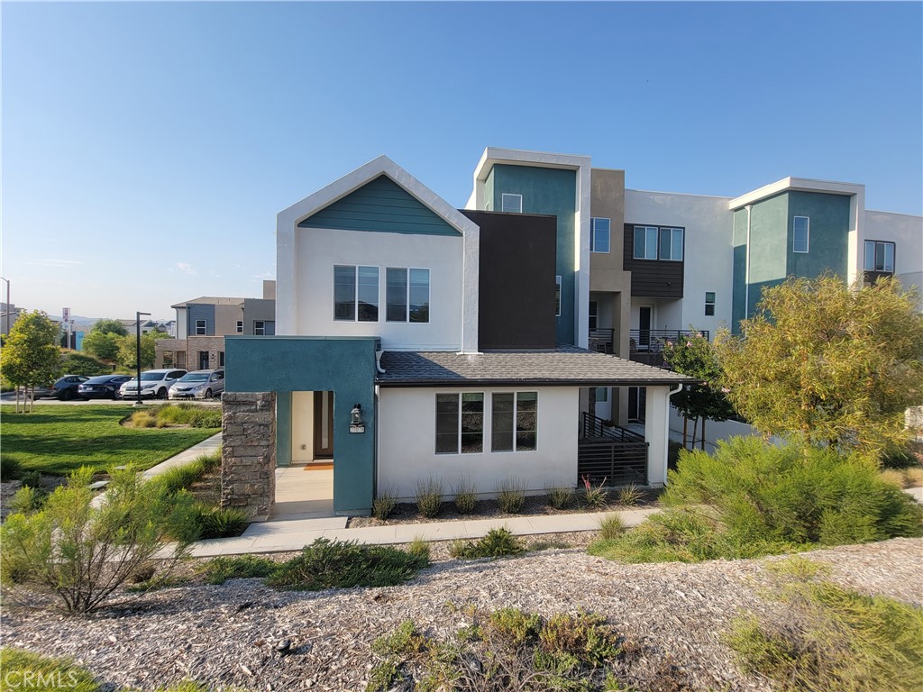 Beautiful Five Point Valencia two-story home waiting to be your next home.
This modern home offers three beds/ 2.5 baths with 1800 SQFt of living space; as you walk in, you will find an open concept living area with a large kitchen with Quartz countertops, a huge island, and all stainless steel appliances, living and dining room areas.
Outside the kitchen, you can access the side patio, which is perfect for BBQ or enjoying a beverage.
Also, you will find a guest bathroom and direct access to your two-car garage, which includes an electric car charger.
Upstairs is the large primary bedroom with two separate large closets and a primary bathroom with a large shower and double sinks, down the hall are located two spacious bedrooms that share a jack & jill full bathroom. The laundry room which includes a washer & dryer, completes the upstairs.
This home is located on a corner lot with no front neighbors, which makes it very private and has lots of natural light.
It is located in a vibrant new construction community offering pools, parks, a community garden, HOA activities, and its Farmers Market every Sunday.
Very easy freeway access, and close proximity to Six Flags Magic Mountain, top-rated schools, beautiful grounds, and walking and biking paths. Make this home a perfect place to live.