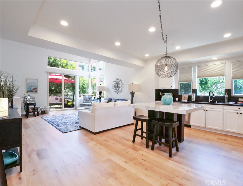 Welcome to resort-like living in the South Bay! This incredible opportunity to be in the exclusive ThreeSixty neighborhood can be yours! Within a private gated community awaits tranquil living at its finest. Soak in the sun and fun with pools, spas, cabanas, outdoor BBQs, parks, a dog park, and sports facilities. Enjoy a private gym, wine room, and recreation room playing games with friends. Located directly across all these amenities, makes this location one of the most desirable in the whole neighborhood. This home is the epitome of move-in ready. With newly refurbished hardwood floors, new HVAC system, automatic blinds, new appliances, and new carpet, this home offers high-end living. With a generous floorpan and as an end unit, it has an abundance of natural light and offers comfortable living with the perfect space to entertain. A large balcony off the living space provides the perfect place to soak in coastal living at its best, unwind from the day, and host guests. As an added bonus, a third entry door allows access from the first level to a private bedroom suite. Summer will come and go and so will this incredible opportunity. Make this moment yours!
