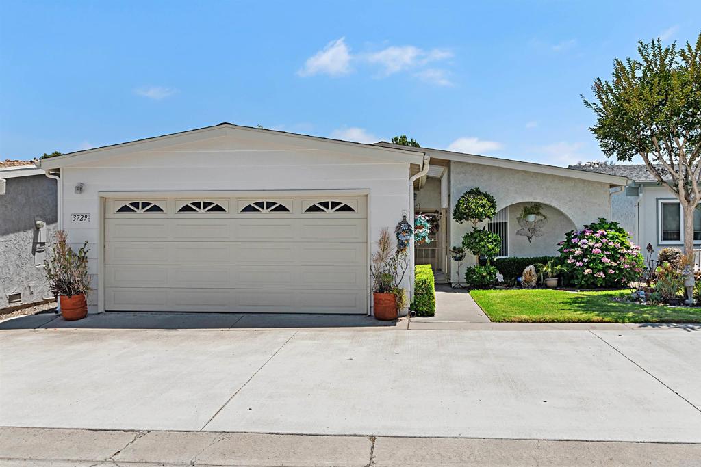 Must-See Opportunity! Welcome to one of the LARGEST DETACHED HOMES in the highly sought-after Oceana East 1 neighborhood. This home boasts of 1507 sq. ft on a cul-de-sac. The elegantly remodeled residence features a detached 2 car garage complete with a utility sink for added functionality. Inside, the spacious kitchen features custom cabinetry, granite countertops & a large island for entertaining. The open floor plan is enhanced by beautiful wood flooring, ceiling fans in every room, & tasteful upgrades throughout. The custom-built entryway closet provides ample & convenient storage. An oversized skylight in the kitchen, along with another in the bathroom fills the home with natural light. The primary bedroom suite includes a large custom-built walk-in closet, providing again abundant storage. Step outside to enjoy 2 private backyard patios, each with awnings for shade and offering peaceful greenbelt views & a peek-a-boo ocean view - perfect for relaxing or entertaining guests. Additional features include central air conditioning and heating, ensuring comfort year-round. Residents enjoy a low-priced HOA fee that covers a wide range of resort-style amenities, including a pool (heated seasonally from approximately April-October), spa, & shaded cabanas. The clubhouse offers space to host private events & is equipped with a billiard table, darts, games, TV & more. HOA dues also include water, trash, sewer & basic cable/tv. Newer washer & dryer, refrigerator, microwave & dishwasher ALL convey with home. Don't miss this rare opportunity to own this beautifully upgraded home in one of the most desirable 55+ Coastal Oceanside Communities. Only a few minutes to Oceanside/Carlsbad beaches, shopping & restaurants. Check out the video tours attached!