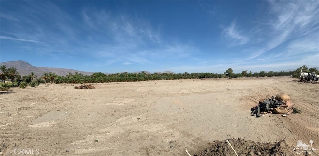 Opportunity Knocking on this private over 10 acre property with an 8% CAP RATE. The Mobile Office Trailer is included in the purchase price and is in 'as is/where is' condition. It has 8 private offices, conference room, kitchenette, 2 bathrooms and its own separate entrance with covered patio and Parking galore. All the electric and plumbing is connected and operational. Permits were obtained thru the County of Riverside. All this plus fully separate 3 bay metal maintenance and service building with concrete pads and 14 foot roll up doors. This is a Ranchers/Farmers/Nursery/Contractors/Investors dream opportunity. Approximately 2 acres of the property are currently being used as a Palm Tree Nursery. Over 7 acres are open, flat and graded, to be used as the new buyer desires. Don't let this one get away as there are very few like it. Seller will cooperate with a 1031 Exchange as necessary and Lease back a portion of the property after close of escrow.