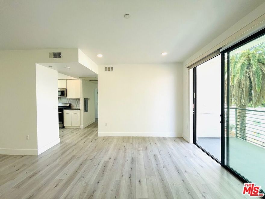 Freshly painted! Light & Bright - Sparkling clean and ready for move-in. Modern luxury living nestled in the heart of Van Nuys with 2 bedrooms, 2 bathrooms and city/mountain views. Built in 2020 and features quartz countertops, designer backsplash tile, stainless steel appliances (refrigerator, dishwasher, range/oven and microwave), private Washer/Dryer in-unit, Central AC/Heat, recessed lighting, custom shades, and lux-wood-like flooring. Expertly designed to maximize the natural light of sunny California and to enjoy the balcony off of the spacious living room with city and mountain views. This unit includes one (1) gated parking spaces. Building amenities include an elevator, controlled access entry, EV charging, storage rooms (for a separate fee) and a central courtyard. Pets will be considered. Prime location conveniently close to Farm Table Coffee House, the Civic Center, Lake Balboa, parks, archery, Costco, Target, restaurants, shopping, freeways and the famous MacLeod's Brewing Company. Call for additional details.
