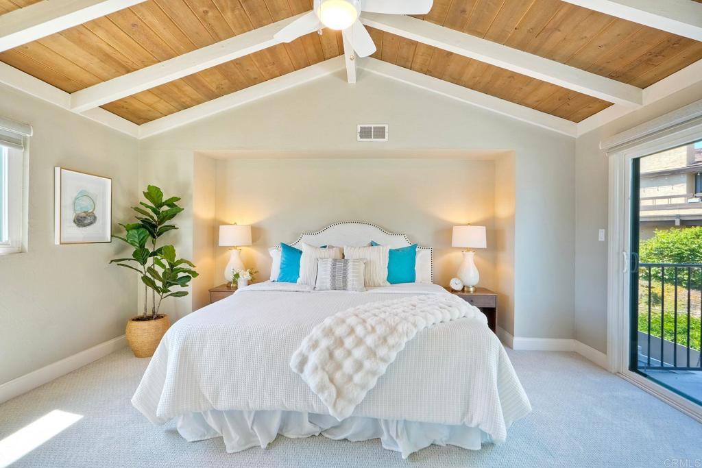 Peace. Privacy. Perfection. Location and privacy are key in this highly sought-after, duplex-style, end unit that shares only one wall. This upscale coastal charmer offers the feel of a private home in a beautifully landscaped community to enjoy expansive greenbelts perfect for morning walks, outdoor relaxation, or simply taking in the serene surroundings. This upgraded beauty features on-trend finishes. Vaulted ceilings with exposed beams, and natural light from the numerous windows that create a farmhouse design style with an open and airy feel. Beautifully remodeled eat-in kitchen with shaker style, soft close cabinets and light, neutral quartz countertops that extend from the kitchen into the dining area with ample storage. Step into your secluded front patio, thoughtfully designed to ensure privacy with no direct views of neighboring units. Inside, you'll find countless high-end upgrades throughout: Dual-pane windows & sliding doors (select sliders tinted for added privacy), Motorized blinds and solar shades—conveniently remote-operated, Custom closets with built-in drawers and cabinetry, Durable vinyl plank flooring in main living areas, plus new carpet in the primary bedroom and stairs, Tiled fireplace with wood mantle and custom cabinet-style screen (gas), Ceiling fans in both bedrooms and the living room, Stylish tile flooring and updated tiled enclosures in both bathrooms.Stay comfortable year-round with a NEW modern, energy-efficient HVAC system. A/C fully updated in July 2024. The spacious two-car garage has been upgraded with epoxy floors, insulated steel door, painted walls, and ample storage. A refrigerator and full-size washer and dryer are included for convenience. With only two units in the building, this home offers a uniquely private and quiet living experience. Move-in ready and thoughtfully upgraded, it’s the ideal blend of comfort, style, and low-maintenance living in La Costa. Ideally located to top rated schools, golf courses, shopping, dining and just minutes from Carlsbad’s world class beaches.