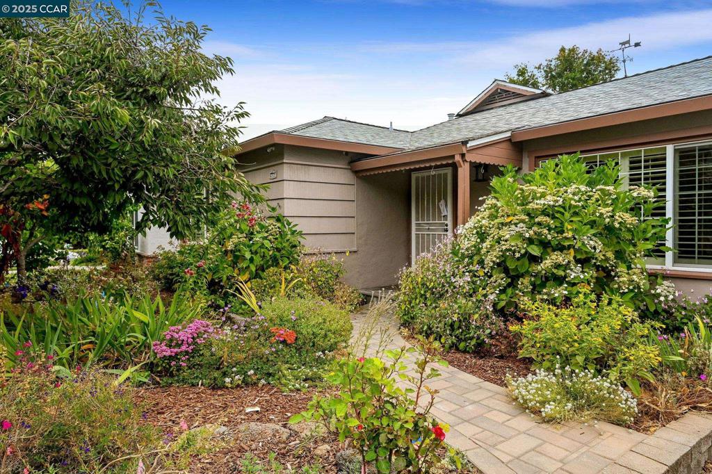 Welcome to 16063 Berkshire in Castro Valley! Nestled in a beautiful garden setting in beloved Fairmont Terrace, this charming East Bay home has been lovingly refreshed just for you. Step inside to gleaming refinished hardwood floors, fresh neutral paint throughout, and a brand-new roof overhead. Cozy up by the fireplace in the inviting living room, or gather with loved ones in the spacious family room—both filled with wonderful natural light, in part thanks to sun tubes. Jetted tub for relaxing. Newer electric panel. New appliances: LG refrigerator, Whirlpool Electric Washer & Gas Dryer 2025. You'll love the Tesla solar system, attic insulation and dual pane windows that keeps energy costs low, while outside, a garden enthusiast's paradise awaits with fruit trees, vibrant flowers, and even a rain barrel for eco-friendly watering. There is a generous deck off the family room for enjoying your favorite beverage or book. Earthquake retrofit in 2006. Located just a few blocks from Fairmont Terrace Park and below Lake Chabot Regional Park, you'll have nature at your doorstep. With convenient shopping and easy commuter access nearby, this move-in ready gem perfectly captures the best of Castro Valley living. SUNDAY 8/10 open house cancelled due to personal emergency.