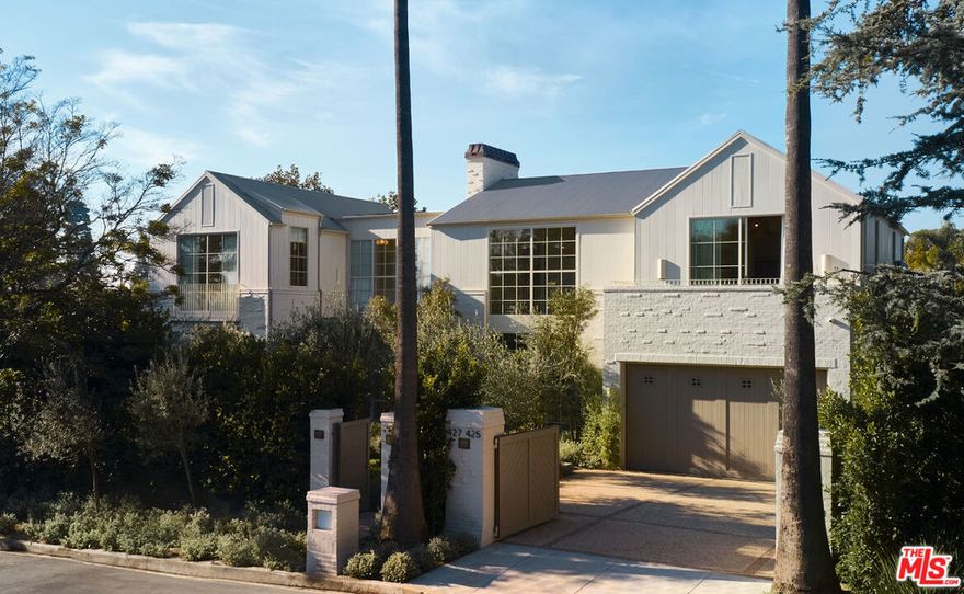 This timeless masterpiece embodies the ideal vision for design enthusiasts, situated in the heart of Brentwood Park, one of Los Angeles most sought-after neighborhoods. Featuring 7 bedrooms and 10 bathrooms, this residence showcases contemporary interiors designed by the esteemed Muskoka Living firm. It is conveniently located near the Brentwood Country Mart, Brentwood Country Club, and trendy shops and restaurants. The interiors impress with double-height ceilings, hardwood floors, and expansive windows framing the lush front and back yards. The open-plan kitchen is equipped with high-end appliances, marble countertops, and a spacious eat-in island. The second-level primary suite offers a luxurious spa-like bath with a soaking tub. The lower level is a haven for entertainment, featuring a theater, living room, gym, and wine room. The outdoor space boasts a pool, spa, and a fully permitted Accessory Dwelling Unit (ADU), surrounded by mature trees. Additional amenities include a pickleball court, a 2-car garage with room for lifts, and two laundry rooms.