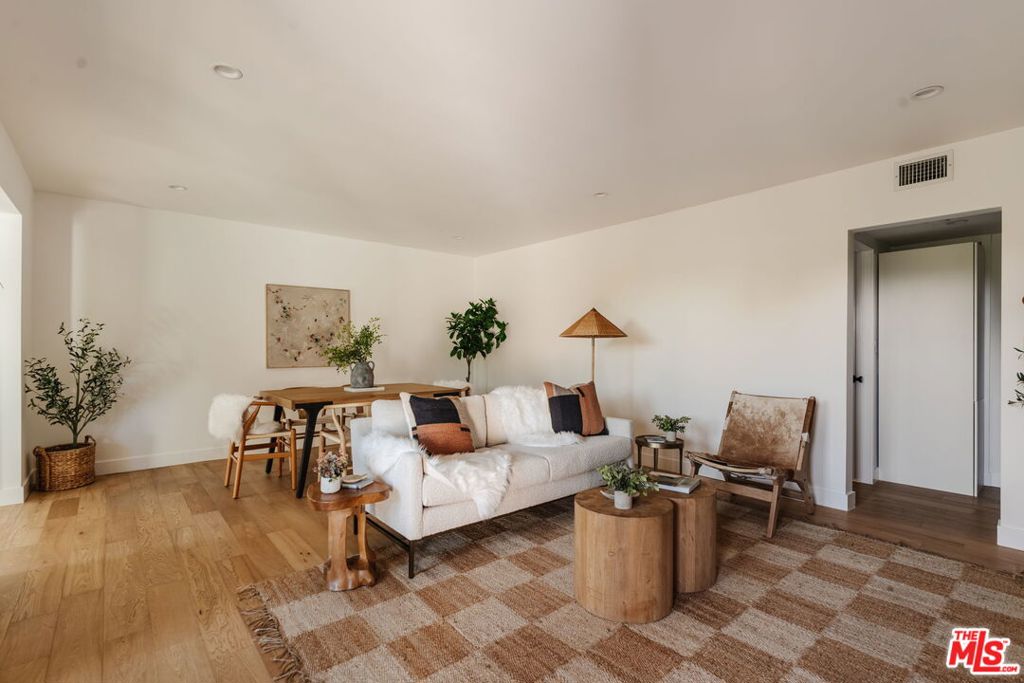 Bright, Spacious & Beautifully Remodeled in Prime Santa Monica. Set in the coveted Sunset Park neighborhood, just minutes from Santa Monica's world-famous beaches, trendy restaurants, and vibrant farmers markets, this stunningly remodeled oversized 1-bedroom is the perfect blend of modern comfort and coastal charm. This clean and airy ground-floor corner unit features French white oak floors throughout, abundant natural light, and plenty of room for a home office. The kitchen is a design lover's dream with an organic tile backsplash, new cabinetry, floating shelves, crisp white appliances, and warm butcher block countertops. Every detail feels thoughtfully curated, from the brand-new black dual-pane windows and recessed lighting to artisan light fixtures, brass finishes, and a gorgeous full bath with bronze-print wallpaper, walnut vanity, and brass accents. The spacious master bedroom offers excellent closets, while the in-unit laundry area still leaves room for extra storage. Outside, a shared lower patio features a redwood deck with lounge and dining spaces, tucked behind lush greenery for privacy. Enjoy Santa Monica living at its best fresh ocean breezes, an unbeatable location, and a home that's as stylish as it is comfortable. EV Car charging at covered carport parking spot. TIC sale, call for Lender referrals.