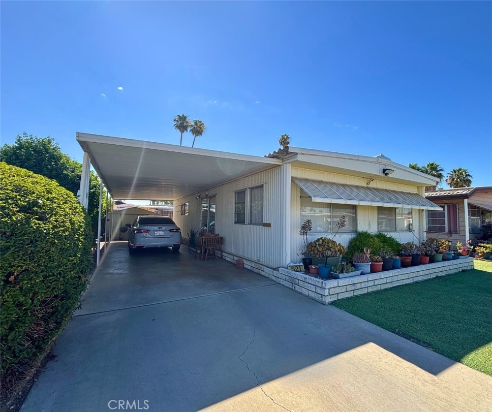 Welcome to 521 San Mateo Cir in the Sierra Dawn Estates, a vibrant 55+ community where you own the land—no land lease! This charming and well-maintained manufactured home features 2 spacious bedrooms and 1 upgraded bathroom, ideally located within walking distance to the pool, clubhouse, and community amenities. Step inside to find beautiful wood flooring throughout, a modernized kitchen with upgraded counters and backsplash, and newer blinds for a clean, updated look. The reglazed bath and standing shower offer a fresh, spa-like feel. Enjoy the convenience of in-unit laundry and a functional layout with a walk-in closet in one bedroom and sliding glass doors in the other, leading to a private, cemented backyard—perfect for relaxing or gardening. Additional highlights include a long carport, a newer storage shed, and access to an active, low-HOA community offering four clubhouses, billiards, games, community events, four pools, a dog park, and a gym.
Don’t miss this opportunity to enjoy low-maintenance living in a wonderful neighborhood that feels like home!