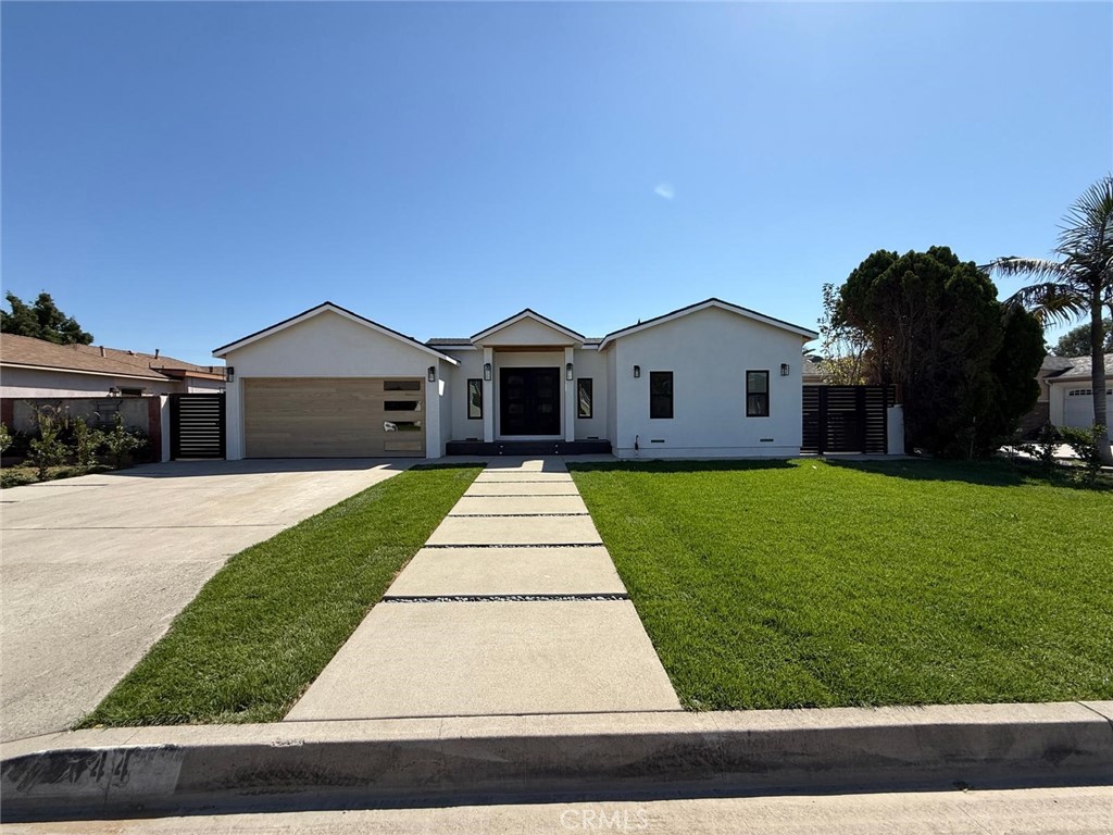 9044 Bigby – North Downey
This spacious 4-bedroom, 3-bath home offers the ideal blend of luxury, comfort, and flexibility in one of Downey’s most desirable neighborhoods. Boasting two luxurious primary suites—each with a full bathroom—this layout is perfect for guests or multigenerational living. The bathrooms have been thoughtfully updated with elegant quartz countertops, richly toned cabinetry, custom mirrors, and modern vanities.
The additional two bedrooms include one oversized room that could serve perfectly as a home office or guest space. The open-concept kitchen is a chef’s dream, featuring custom shaker-style cabinetry, a large center island, quartz countertops, and a cozy dining nook. Designer touches throughout include rich crown molding, stylish lighting fixtures, wood-look flooring, and soothing paint tones that create an atmosphere of sophisticated warmth.
The inviting family room seamlessly into the private backyard oasis. Enjoy year-round entertaining with a rock-accented yard, beautiful stepping stones, a covered patio ideal for al fresco dining BBQ, and a full privacy fence. Additional features include an attached garage with laundry and close proximity to local shopping centers, restaurants, parks, and hiking trails. With convenient commuter access, this is North Downey living at its finest—the perfect package awaits.