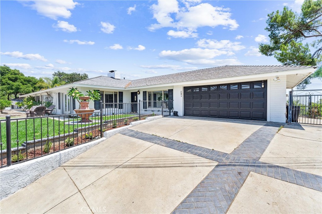 Welcome to 770 & 778 E Avocado Crest Rd.! This unique La Habra property features two separate single-level dwellings, each offering arguably the best views in La Habra Heights. The main house at 770 E Avocado Crest boasts two bedrooms and three bathrooms. The second dwelling at 778 E Avocado Crest has two bedrooms and one bath. Both homes offer breathtaking southerly views spanning from Orange County to Los Angeles, as well as northern views of the prestigious Hacienda Golf Club. Inside, you'll find polished concrete floors and expansive floor-to-ceiling windows that maximize the incredible views. The main dwelling includes a charming front yard, perfect for relaxing, and a back patio area ideal for entertaining. The second dwelling also has its own private backyard and patio. The front entrance to the property is gated for privacy.
With nearly two acres (71,770 sq ft) of oversized lot, there's ample room to create your own oasis. This property also provides abundant parking for additional cars, boats, RVs, and more. These homes offer flexible living arrangements, perfect for separate residences, extended family, or even an office retreat.