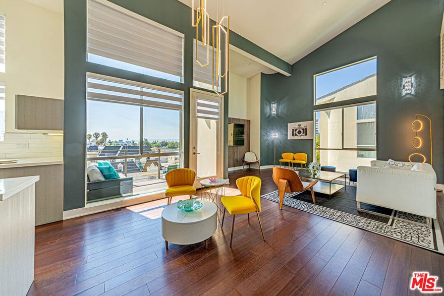 With a newly lowered Price, this one is sure to be in escrow. AMAZINGLY CURATED INTERIOR DESIGNED WITH MODERN LIGHT FIXTURES FOR THE NEXT PROUD PENTHOUSE OWNER. THIS ONE IS FOR YOU!! ONE OF A KIND UNIT, NOTHING LIKE THIS IN THIS BUILDING, UNIQUE AS YOU ARE. COME AND SEE FOR YOURSELF. NEW AUTOMATIC WINDOW BLINDS. NEW MODERN GOLD CHANDELIER, NEW 12 & 16 LIGHTS Modern Crystal & Chrome Dandelion Chandeliers hanging Light Fixtures on the KITCHEN CEILING, NEW BATHROOM VANITY LIGHTS, 13 NEW Crystal Modern Wall Sconce vanity light fixtures throughout the entire home. Wall paneling on Living-room TV wall & Primary Bedroom wall downstairs. Entrance wall papers with inviting flowers. Also, RARE IN THIS LOCATION- Brand NEWLY BUILT IN 2009. 2 BEDROOM 2 1/2 BATHROOMS, LAUNDRY IN THE UNIT. EV CHARGER INSTALLED FOR THE NEXT Home OWNER. MINUTES FROM THE FAMOUS FARMERS MARKET, THE GROVE, THIS IS THE "IT" PLACE. MUSEO, truly the heart of LA. Enjoy the convenience of sites and stores within short distance. This condominium has a sleek and modern design and features many amenities. Lounge with your coffee or a cocktail on your private balcony as you enjoy your Best city view. Bask in natural light and the openness your cathedral ceilings provide. Add a spacious living area to complement the ambiance. Your luxury penthouse comes with secured underground parking for up to 2 cars and a gym with both machines and weights. Don't let this opportunity pass you by to enjoy city living in elegance, style & convenience. Don't miss it!!