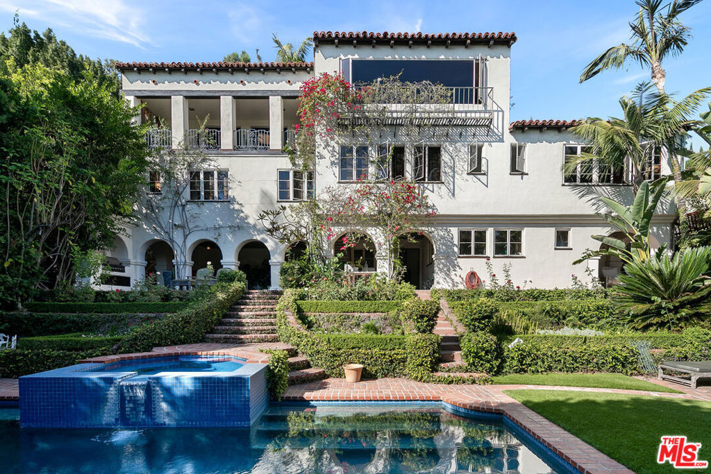 EMOTIONAL SPANISH COLONIAL REVIVAL VILLA, Don Uhl, AIA, circa 1927. Set in the prestigious celebrity enclave of Las Colinas Heights, this landmark Spanish Colonial Revival residence originally crafted by renowned architect Don Uhl, is a rare opportunity to reimagine a timeless architectural treasure. Surrounded by notable estates and historically significant properties on a quiet cul-de-sac, the home boasts panoramic jetliner views stretching from Downtown Los Angeles to the Pacific Ocean. Stripped to the studs and awaiting a transformative restoration, the property offers an extraordinary canvas whether to fulfill the vision of the current owner (renderings available upon request) or bring your own aesthetic to life. Plans call for a breathtaking full-scale restoration and reimagining, inside and out. From the formal entry, you're drawn into a grand, Chateau Marmont-inspired great room featuring original hand-stenciled ceilings, an oversized fireplace, and French doors that open onto an expansive terrace with sweeping city-to-ocean vistas. The main level also includes a formal dining room, butler's pantry, kitchen, and powder room all with direct access to the two-car garage providing a layout ideal for both refined entertaining and modern-day living. The home offers four spacious ensuite bedrooms with ample opportunities for custom closets or expanded living configurations. On the lower level, a columned, covered loggia evokes Mediterranean elegance and provides versatile open-air space for lounging, entertaining, or wellness use. This level also includes a secondary kitchen and access to the beautifully hedged backyard. The private garden features a dramatic swimming pool, an elevated spa, and multiple landscaped zones for outdoor living. Uhl's architectural hallmarks harmonious balance of ornate detail and connection to nature lives on in this masterpiece. His legacy includes iconic estates in Beverly Hills and Hancock Park, notably the MGM Louis B. Mayer Estate. This is more than a property, it's a legacy opportunity, inviting both discerning end-users and visionary developers to complete a masterpiece in one of Los Angeles' most storied neighborhoods. Some images may be digitally altered or virtually staged. Renderings are for illustrative purposes only and may not reflect final design or condition.