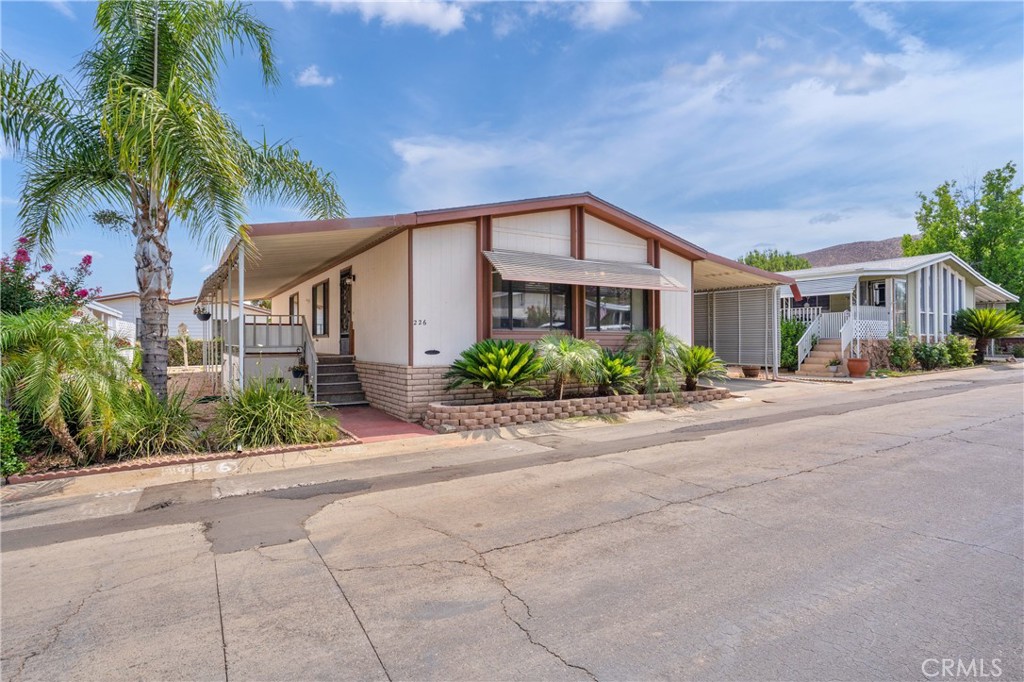 **BACK ON MARKET**no fault of Sellers, buyer was unable to get park approved**
Welcome to Hillside Mobile Home Estates, a Gated 55+ Community in Menifee! This well-maintained 2 bedroom, 2 bath home features a spacious open floor plan with vaulted, beamed ceilings. The dining area includes a beautiful built-in hutch and opens to the kitchen. Recent upgrades include a brand new water heater, all new plumbing underneath the home and new laminate flooring in the kitchen and laundry room.
The covered carport fits 2 cars and includes a storage shed.
Community amenities include a large clubhouse, swimming pool, weekly activities, and on-site RV storage. Conveniently located near shopping, restaurants, and with easy access to the 215 Freeway. Don’t miss this opportunity to live in Menifee, one of California’s fastest-growing cities!