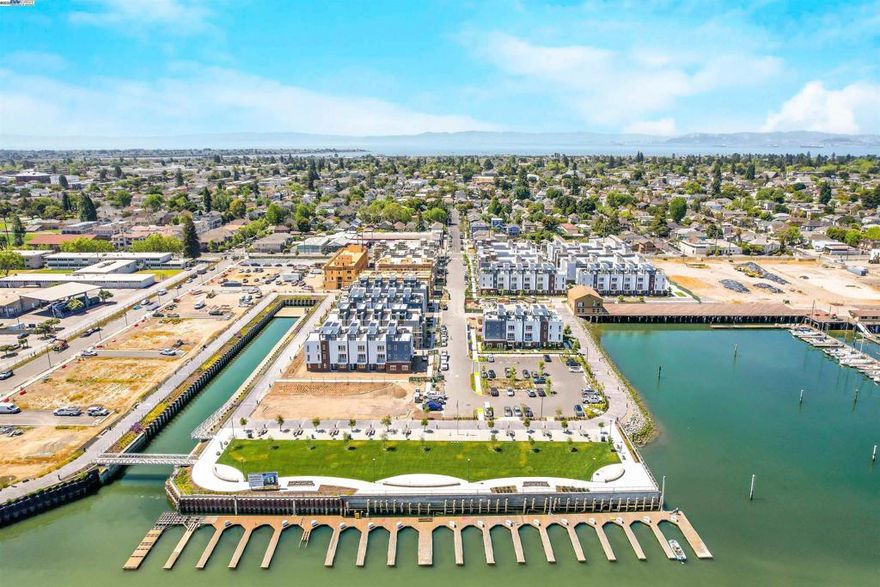Step into the future of modern island living with this spacious 3-bedroom, 3.5-bath Island View Plan 6 townhome—one of the largest in the Island View collection at Alameda Marina. This corner unit offers nearly 2,200 sq ft of open-concept living and dining, a gourmet kitchen with Samsung appliances, quartz countertops, storage, a private balcony for indoor-outdoor enjoyment and featuring energy-efficient design. The luxurious primary suite includes a walk-in closet en-suite bathroom, while each secondary bedroom also has its own private bathroom. One bedroom suite is located downstairs on the ground floor. The home also has upstairs laundry, a 2-car garage with EV charging outlet, and solar panels installed. This nearly completed home offers move-in ready comfort with all selections installed, showcasing the Island View Plan 6’s thoughtfully designed spaces and premium finishes. Ask about our Home of the Week special builder promotion! Part of the Alameda Marina master-planned redevelopment, residents enjoy community parks, waterfront trails, the historic boathouse, and easy access to downtown Alameda, South Shore Beach, ferry/BART, and Oakland & SF. *Photos are of the Plan 6 model home; actual finishes may vary. Views:  Downtown