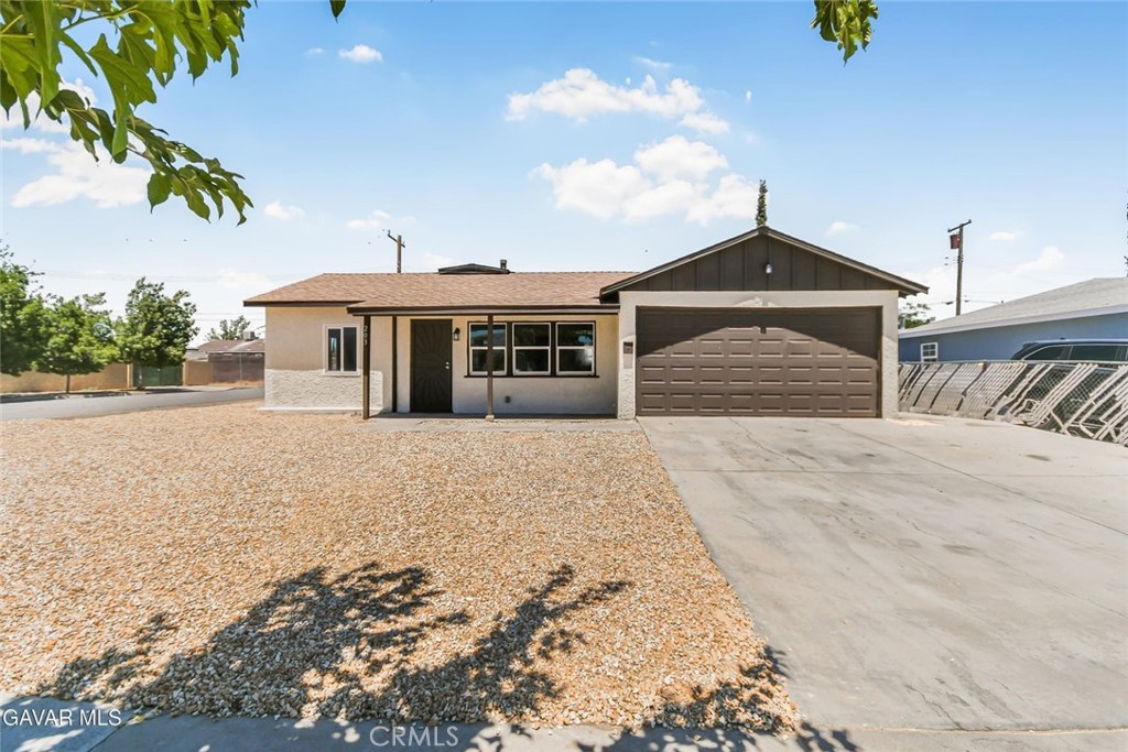 This beautifully renovated corner-lot home has been treated to a full interior and exterior paint refresh, giving it a clean, modern look inside and out. Step into the heart of the home and you'll find a stylish kitchen featuring gleaming granite countertops, freshly painted cabinets, a brand new stainless steel stove and dishwasher, a stainless steel undermount sink with a new faucet, recessed lighting, and a sleek drop-down hood that ties it all together. Brand new plank flooring runs throughout the entire property, creating a seamless and updated feel in every room. The bathroom has been thoughtfully updated as well, with a new vanity and toilet, custom tile shower surround, freshly glazed tub, new lights, and upgraded plumbing fixtures, all adding to the move-in ready appeal. Out front, you'll love the crisp new rock landscaping that provides curb appeal with low maintenance, while the backyard offers a spacious covered patio that's perfect for relaxing or entertaining. There's also a custom gate with RV access along the side of the property—great for extra vehicles or trailers. The dual pane vinyl windows throughout add energy efficiency and natural light, and the brand new roof adds peace of mind. All of this is located on a corner lot with a 2-car garage and indoor laundry area, making daily living convenient and practical. The home is equipped with a mini-split system for both heating and cooling, ensuring year-round comfort. Located in a desirable area, close to shopping, dining, and schools, this is a rare offering you don't want to miss—come see this move-in ready beauty today!