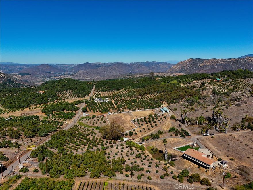 Exceptional 10 Acre Equestrian Retreat in Northwest Valley Center. 
Discover the perfect blend of rural charm with equestrian living and plenty of room to expand use on this expansive horse property surrounded by sweeping mountain vistas and more.  Featuring a serene park-like setting with mature fruit and avocado orchard, potential farm land use, and a well-appointed equestrian arena, this property perfectly blends natural beauty with practical functionality. 

The Home is made for rural living in a desirable quiet Country setting in San Diego County! Lovingly maintained and updated this home is move in ready. The 2,030 sq. ft. Single-level residence features: 
* 3 bedrooms and 2 bathrooms, family rooms, dining area and kitchen.
* Private small office/laundry room with sliding door area in lower parking driveway area.
* Large inviting porch and outdoor deck area – perfect for a BBQ and relaxing California evenings.
* Built in 1977, the home offers updated amenities with enough space to personalize.

Equestrian Facilities designed with horse lovers in mind: 
* 12'x12' enclosed Tack Room!
* 60'x36' MD barn with cathedral ceilings bringing in a lot of natural light. 
* 8 working stalls each 12'x12' with sliding doors making room for 4 foals.
* Excellent drainage throughout. 

Land Advantages: 
Enjoy the charm and potential income of an active avocado grove, complemented by a fruit orchard with pomegranates, Asian pears, Star Ruby grapefruits, lemons and oranges. The property also offers expansive usable land, ideal for future customization, expansion such as farm land, and additional amenities. 

Lifestyle & Location: 
Enjoy the serenity of panoramic mountain views —an ideal blend of privacy with an active equestrian retreat. Whether you’re an equestrian enthusiast, professional trainer, or simply seeking the ranch lifestyle, this property offers the space, infrastructure, and beauty to make your vision a reality. 
More than just a property—this is a lifestyle opportunity. With strong infrastructure and room for your personal touch, this rare Northwest Valley Center find is offered for the first time in nearly 30 years. 
Act now—this equestrian retreat won’t last!