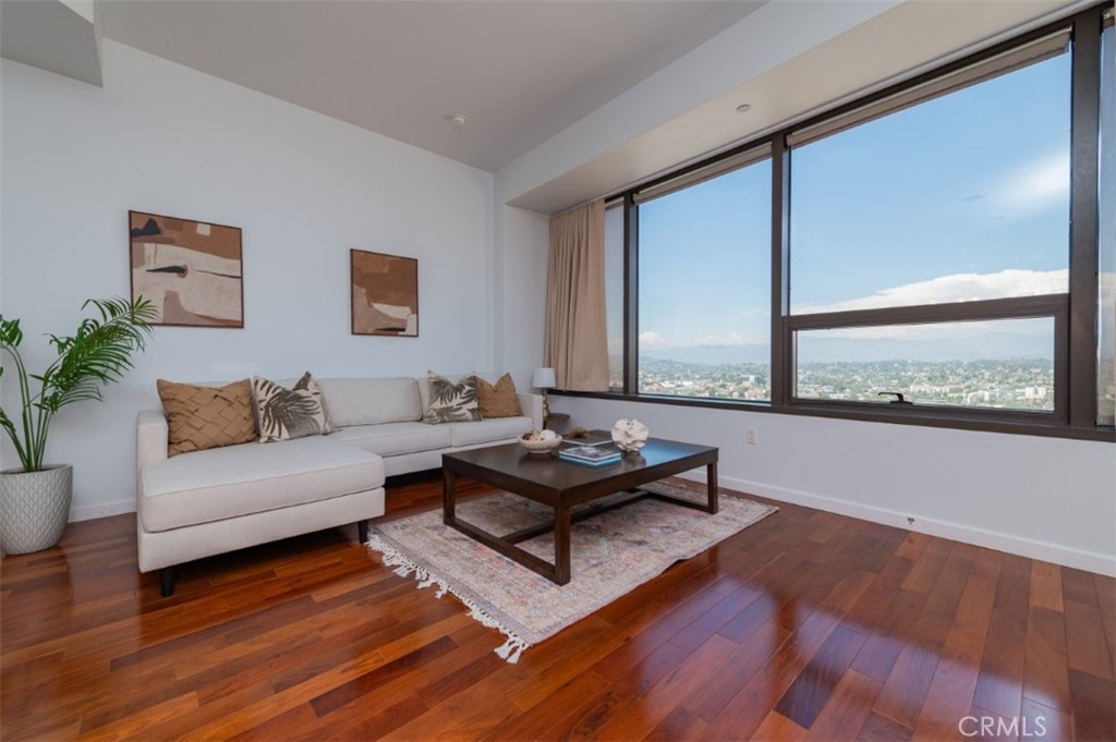 Experience city living at its finest in one of Downtown Los Angeles’ tallest and most prestigious residential towers. This 28th-floor 1-bedroom, 1-bath condo offers breathtaking panoramic sunset and skyline views through expansive windows. The open-concept layout features soaring ceilings and a modern kitchen with granite countertops, stainless steel appliances, and ample cabinetry. The elevated bedroom includes walk-in closets, plush carpeting, and unobstructed city views, while the bathroom boasts a soaking tub, walk-in shower, and oversized vanity. In-unit laundry and abundant storage add everyday convenience. Residents enjoy world-class amenities on the 17th-floor Sky Deck, including a heated infinity pool, spa, cabanas, lounge beds, fire pit, BBQ grills, and wet bar—all with sweeping city views. Additional perks include 24-hour concierge, fitness center, media/screening room, business center, guest parking, and controlled access. Perfectly located in the heart of Downtown LA, minutes from Little Tokyo, LA Live, Crypto.com Arena, 7th & Fig, Whole Foods, Arts District, and Echo Park, with easy access to the 110, 10, and 101 freeways. Don’t miss this rare opportunity to own at 1100 Wilshire!