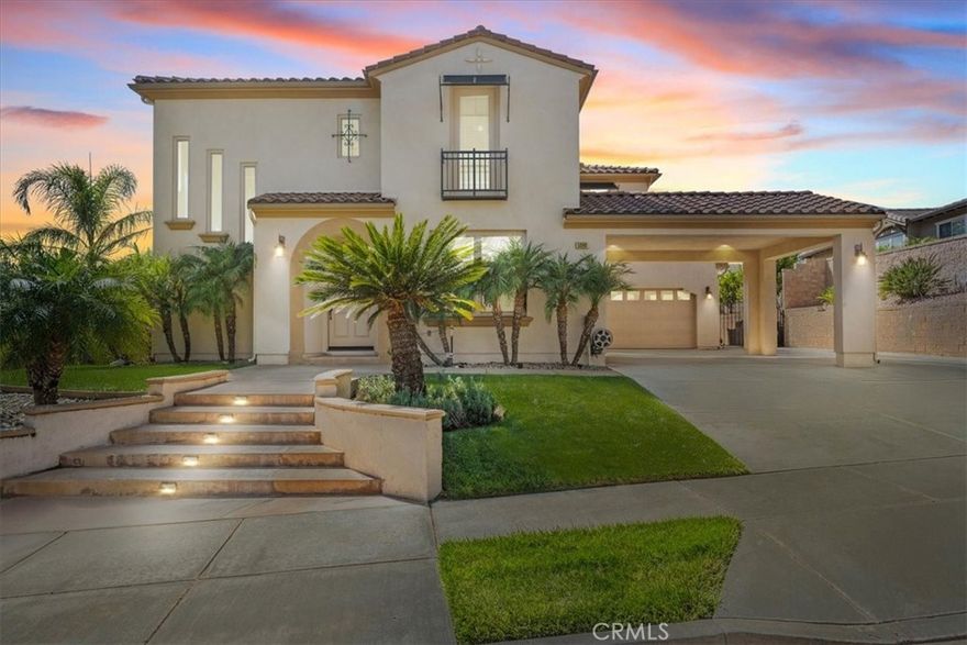 This home has everything you could desire — an amazing floor plan, breathtaking city and mountain views, and a beautiful pool and spa. Located in the private, gated community of Rancho Etiwanda Estates, this two-story home features a spacious foyer, guest bath, living room, and formal dining room. The kitchen offers an island with bar seating, a walk-in pantry, and opens to the family room, breakfast nook, and laundry room, which leads into the 3-car tandem garage. The lower level also includes a second staircase to the upper level and a bedroom with its own private bath, ideal for guests or multigenerational living. Upstairs, you’ll find a loft area perfect for a game room, three additional bedrooms each with their own bath, a workspace, and a luxurious primary suite. The primary suite features a sitting area with a fireplace, access to a private balcony, and a spa-like bath with dual vanities, a makeup counter, separate shower and tub, and two walk-in closets. Additional highlights include a porte-cochere leading to the courtyard, extra driveway parking, professional landscaping, a gas firepit, outdoor BBQ island, covered patio area, an in-ground pool with a baja shelf and pebble-tec finish, and an in-ground spa with a waterfall. Located in an award-winning school district and close to major shopping, dining, and entertainment — including Victoria Gardens, Ontario International Airport, and Toyota Arena. Every moment you wait, someone else could take your opportunity.