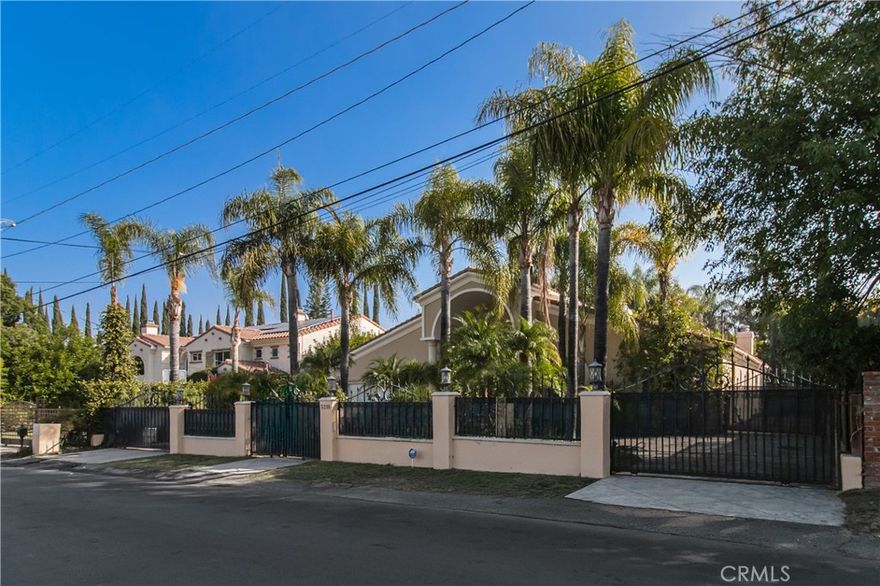 Located in one of the Tarzana's most desirable neighborhoods, this remarkable home perfectly combines elegance and comfort. The main residence offers five spacious bedrooms and five bathrooms with soaring ceilings that fill the interior with natural light and a true sense of openness. Each room is thoughtfully designed to create an inviting atmosphere ideal for both everyday living and entertaining. A beautifully finished two-bedroom, one-bath guest house provides exceptional flexibility, ideal for extended family or guests. The chef’s kitchen is equipped with professional-grade appliances and flows seamlessly into the living room, where a fireplace adds warmth and character. Outside, the backyard feels like a private resort with a sparkling pool and spa, a basketball court, a large grassy lawn, and a built-in BBQ for effortless outdoor entertaining. With RV access and generous outdoor space, the property offers both luxury and functionality. Perfectly situated just moments from Ventura Boulevard’s best dining, shopping, and local amenities including Trader Joe’s, Sephora, and nearby places of worship, this home delivers the best of Valley living. Unfurnished and ready for immediate lease, it offers space, versatility, and an elevated lifestyle in a prime location.