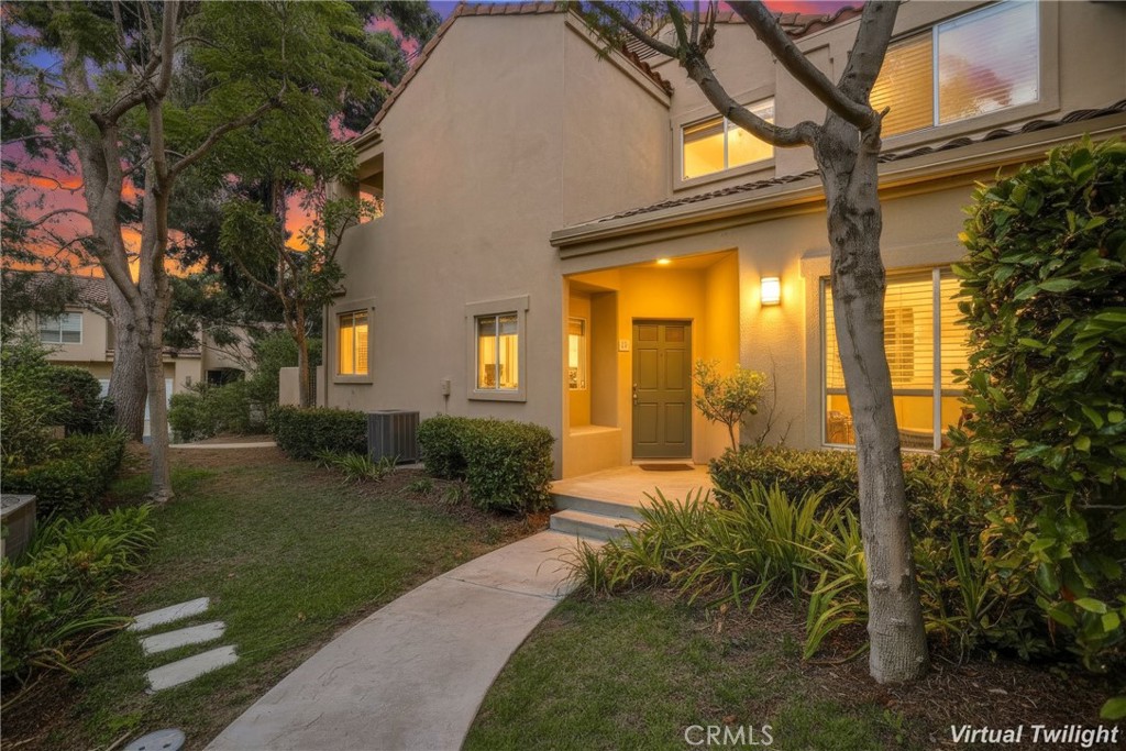 Prepare to fall in love with this beautifully updated and well-maintained home superbly located in the highly desirable Encore at Marina Hills community, the perfect example of pride in ownership. You will adore the private location, a superb setting for peaceful living in this friendly Marina Hills community ideally located a short walk from Parc Vista Park and Marina Hills Park. As you enter, the flush mount Crystal chandelier in the entry way sets the tone in this graceful home with Ceramic tile floors throughout the main level, custom lighting, a neutral palette, and a well-designed floorplan. The living room is open to the dining area and has direct access to the backyard patio, creating an ideal indoor-outdoor living space for gatherings with friends and family around the cozy stacked stone living room fireplace. The elegant Kitchen was beautifully remodeled with exquisite cabinetry, soft close doors and drawers, gorgeous Quartz countertops, marble backsplash, built-in wine fridge, recessed lighting, stainless steel appliances including a 2024 KitchenAid dishwasher, undercabinet accent lighting, and direct access to the backyard patio, perfect for entertaining. The main level includes a highly sought-after full bathroom with walk-in shower, and a bedroom with built-in cabinetry and workspace, window seat, and mirrored closet doors, perfect for an executive home office or 3rd bedroom. The newly carpeted stairs lead you up to the dual bedroom suites, each with an ensuite bathroom and laminate floors, including a primary suite with an updated bath with dual Quartz topped vanity, gorgeous cabinetry, upgraded lighting, a large walk-in closet, and a private balcony taking advantage of the cool ocean breezes, and peek-a-boo views towards the coast, an ideal setting for an evening glass of wine with a loved one. The convenient main level laundry room has full size washer and dryer hookups, linen cabinets, and dual light switches. The enclosed backyard is a private oasis perfect for relaxing and BBQing, with sealed flagstone patio, sprinkler and drip system, and gated exterior access. The attached 2 car garage has motion sensor lighting, built-in cabinetry & overhead storage racks. Encore amenities include a sparkling pool & spa, lounging & picnic areas. Community re-piped in 2018. Close to Marina Hills Park pool, clubhouse, tennis courts, playgrounds, sports fields, & sport courts, shopping, dining, hiking & biking trails, and minutes from local beaches.