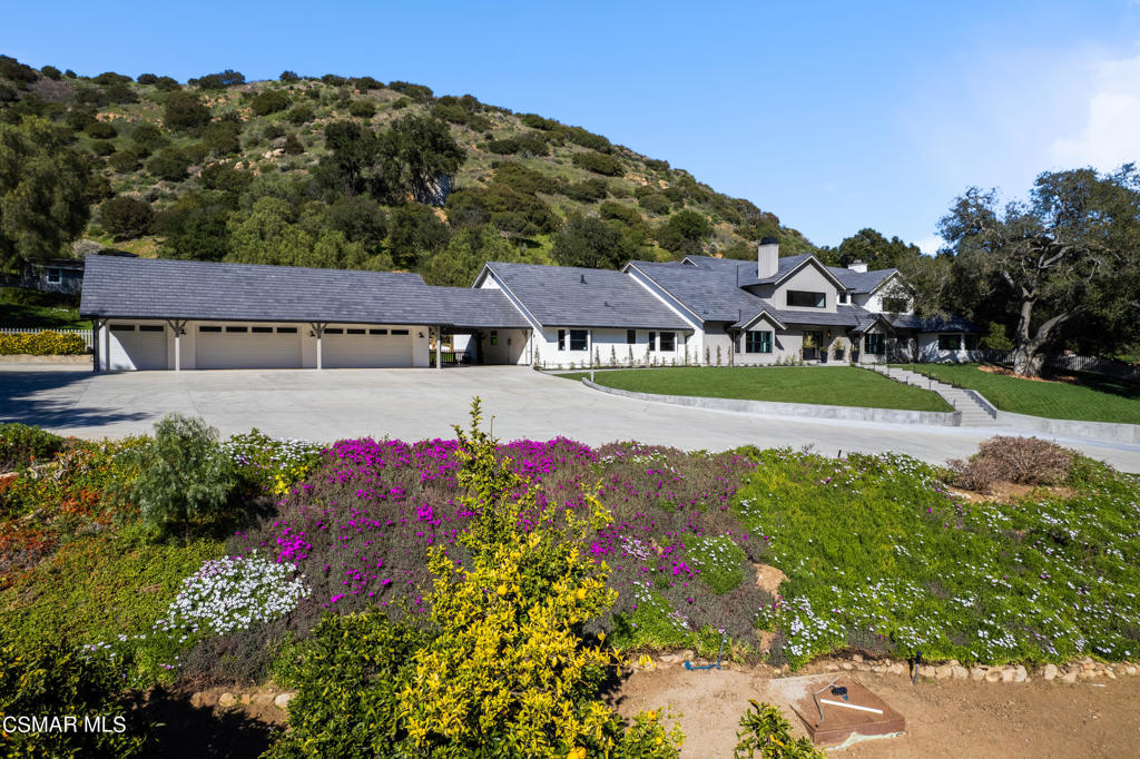 Discover elevated living and create your family's legacy in this natural paradise, thoughtfully designed for seamless indoor-outdoor living. Welcome to Islandia Farms, nestled in the tranquil and picturesque Hidden Valley. This extraordinary private compound has been recently renovated and reimagined to provide luxurious estate living across approximately 23 acres of rolling hills, enhanced by sweeping ocean breezes and breathtaking views of the majestic Santa Monica Mountains.The newly updated main house, boasting an epic kitchen at its heart, spans an impressive 9,000 sq. ft. and is enveloped by lush landscaping, a 5-car garage, a sparkling pool, and a lighted tennis court, creating an oasis of luxury and tranquility. Adding to the allure, a charming two-bedroom guest house complements the main residence, providing additional space for guests or extended family.Equestrian enthusiasts will revel in the state-of-the-art 24-stall center aisle barn, covering approximately 17,000 sq. ft. The equestrian facility includes a regulation dressage arena, a jumping arena, an automated walker, a lunging pen, 3 grooming stalls, 4 wash racks, 2 bathrooms with showers, 3 offices, 2 tack rooms, a feed room, and 2 kitchens. Additional equestrian amenities include a hay barn with attached trainer's and assistant's apartments and a detached ranch manager's house.For those with varied interests, the property also features a 4,000 sq. ft. workshop or car collector's barn.Located just 35 minutes from Los Angeles and 20 minutes from Malibu, this property presents a rare opportunity to enjoy a rural lifestyle in a blissfully secluded equestrian setting while harmonizing with the natural beauty and tranquility of its surroundings. At an exceptional value, discover a haven where luxury meets nature and creates lasting memories in this stunning estate.