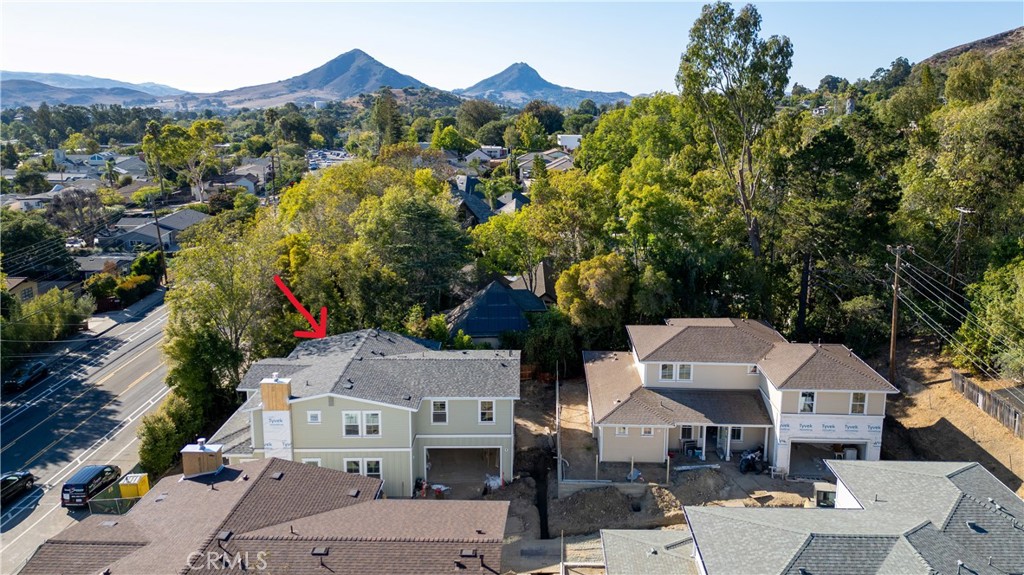Only 2 homes left! Welcome to this exceptional new construction home by renowned builder Greg Nester, set for completion in December 2025. Offering 3,059 sq. ft. of thoughtfully designed living space, this property includes a 3-bedroom, 3.5-bath main residence plus a 1-bedroom, 1-bath ADU, blending modern elegance with functional versatility. The open-concept layout features a gourmet kitchen with premium appliances, custom cabinetry, quartzite countertops, and a large center island, seamlessly connecting to the dining and living areas—perfect for entertaining. The luxurious primary suite provides a serene retreat with a spa-inspired bath, dual vanities, and a spacious walk-in closet, while two additional bedrooms each feature en-suite baths for ultimate comfort. A stylish powder room offers added convenience for guests. The attached ADU, with its own private entrance, kitchen, living area, bedroom, and bath, provides incredible flexibility—ideal for rental income, a guest suite, or multigenerational living. Designed with energy efficiency and high-end finishes throughout, this home also offers a covered outdoor living space to enjoy year-round. Situated in a desirable neighborhood near shopping, dining, and top-rated schools, this is a rare opportunity to own a truly exceptional property.