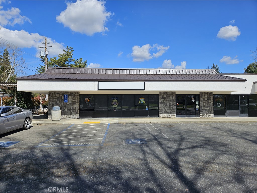 Turnkey restaurant space- now vacant and available for lease. Great location with exposure, easy access, and ample parking. Space includes a large dining area, fenced patio, prominent bar, and full kitchen with a wood fired brick oven. Includes hood system, walk-ins, grease trap, etc. Property also includes solar.
