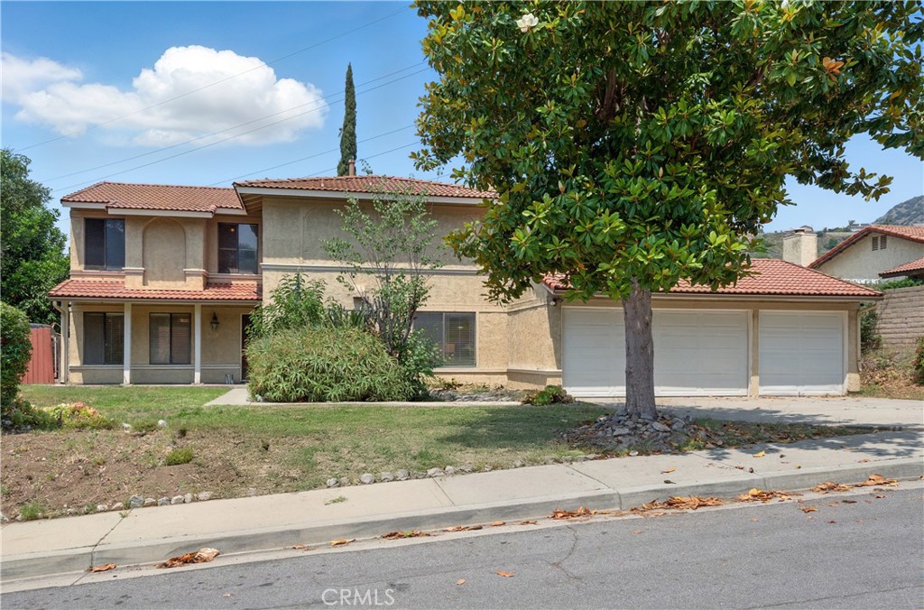 Welcome to this 4-bedroom, 3-bathroom home located in a cul-de-sac neighborhood in San Dimas. This two-story corner lot property is full of potential and ready for your personal touch. The home is being sold as is and needs some TLC, making it a great opportunity for buyers looking to update and make it their own. Step through the double-door entry into a spacious layout featuring a living room that opens to the dining area with sliding glass doors to the backyard. The kitchen with an eating area also offers backyard access, and the cozy family room includes a fireplace. Downstairs you'll find a convenient half bathroom and a laundry room with access to the outside. All 4 bedrooms are located upstairs, including the primary bedroom with double sinks and a soaking tub. The large backyard includes a patio area and grassy space perfect for relaxing or entertaining. A 3-car attached garage provides plenty of parking and storage. Located near great schools, parks, and shopping, this home also offers access to a community pool and spa. Don’t miss your chance to bring your ideas and make this home your own.