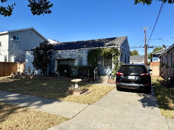Opportunity knocks on a sizable lot in Lakewood Village! Situated on a spacious 5,354 sq ft lot with ADU or Family Compound potential, the home features a 1,030 sq ft footprint, ideal for those looking to renovate, expand, or simply invest in a prime neighborhood for the long run. This prime location on a mature tree-lined street in one of the most desirable pockets of Lakewood makes this classic 3-bed, single-story Ranch an inviting opportunity for the future.
The home welcomes you with a formal dining room, original hardwood floors, and plenty of natural light throughout. The detached 2-car garage and long driveway provide ample parking and even ADU potential (buyer to verify local regulations). The backyard is both large and versatile, ready to be transformed into the outdoor space or family compound of your dreams. Whether you're a first-time buyer with a vision, a savvy investor, or a contractor looking for your next project, this home presents a solid canvas with great bones in a high-demand area.
But what truly sets this property apart is its location: you can enjoy walkability and quick access to Mayfair Park, Lakewood Mall, Heartwell Golf Course and more local hotspots. Commuters will love the convenience of being close to The 91, The 605, The 710, and The 405 freeways, while families will appreciate the proximity to schools in the Bellflower Unified School District.
Additional highlights include:
* Central location in a quiet, established neighborhood
* Plenty of upside potential with room to renovate or expand
* Just minutes away from Long Beach Airport, LBCC and some of the best restaurants in the area
* Mature trees and quiet suburban charm
This is a chance to own in an ideal location at an entry point that leaves room for customization. With the right updates, this property could easily become the crown jewel of the block. Sold as-is, this is your chance to build sweat equity and create something special in Lakewood Village.
