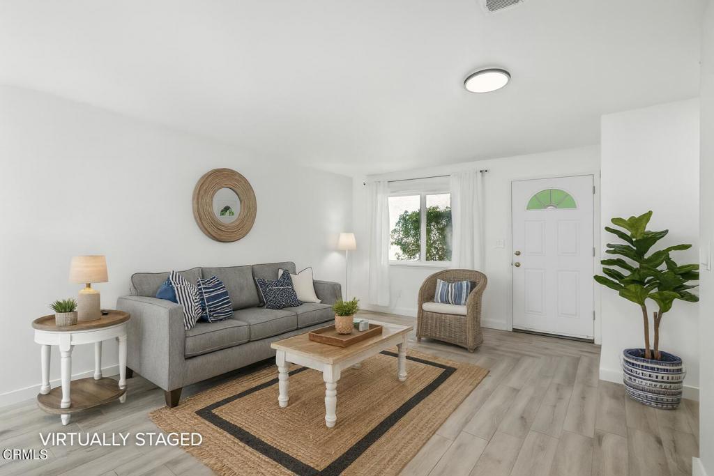 Welcome to this beautifully updated townhome in the heart of Northridge. Step inside to find a bright and inviting living space leading to a fully remodeled modern kitchen with LG appliances, and featuring sleek white cabinetry, quartz countertops, custom lighting, and stylish tile flooring -- perfect for cooking and entertaining.The versatile floor plan includes a convenient downstairs bath that has been upgraded with a modern tiled shower, plus the addition of a stackable washer and dryer for in-home laundry convenience.Upstairs, you'll find a full bath and 2 spacious bedrooms with walk in closets and great natural light. Outside, charming French doors lead to your private brick patio offering plenty of room for relaxing or hosting friends.This well-maintained community offers desirable amenities including 2 designated covered parking spaces, a sparkling pool, spa, kiddie pool, clubhouse, secure mailbox area, and additional laundry facilities.With its prime location near shopping, dining, and easy freeway access, this home offers the perfect blend of comfort, style, and convenience -- a true gem.