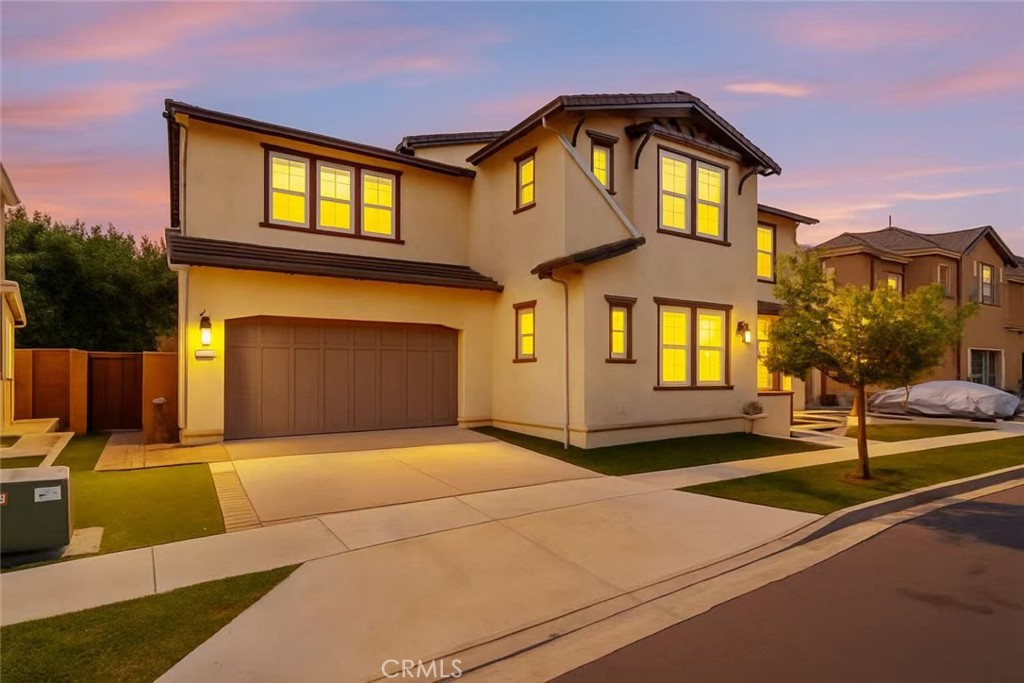 This stunning residence, built by CalAtlantic in 2017, is nestled in the prestigious and serene Greenwood community of Tustin Legacy, offering a perfect blend of modern sophistication and everyday comfort. The beautifully landscaped front yard and welcoming covered porch create a warm and inviting entry.
Main Level
The first floor is thoughtfully designed with two private ensuite bedrooms, providing exceptional flexibility for multi-generational living or guest accommodations. The bright, open-concept layout seamlessly integrates the dining room, living room, and gourmet kitchen, which is equipped with premium KitchenAid stainless steel appliances. Expansive sliding glass doors open to a covered outdoor living area and a low-maintenance backyard—ideal for entertaining and effortless indoor-outdoor living.
Upper Level
Upstairs, the spacious primary suite showcases dual vanities, an oversized shower, and two walk-in closets. Additional bedrooms are comfortably sized, while a versatile loft opens to a private balcony with community views, offering the perfect space for relaxation or entertainment. A separate laundry room further enhances everyday convenience.
Community & Location
Residents of Greenwood enjoy resort-style amenities, including a six-acre park with amphitheater, swimming pool and spa, BBQ areas, basketball courts, clubhouse, scenic trails, and a children’s splash zone. The home is ideally located near the esteemed Legacy Magnet Academy, top-rated schools, The District shopping and dining center, John Wayne Airport, and major freeways.
With its rare combination of luxury, comfort, and convenience, this home presents an exceptional opportunity to own a true gem in one of Tustin’s most sought-after neighborhoods.
